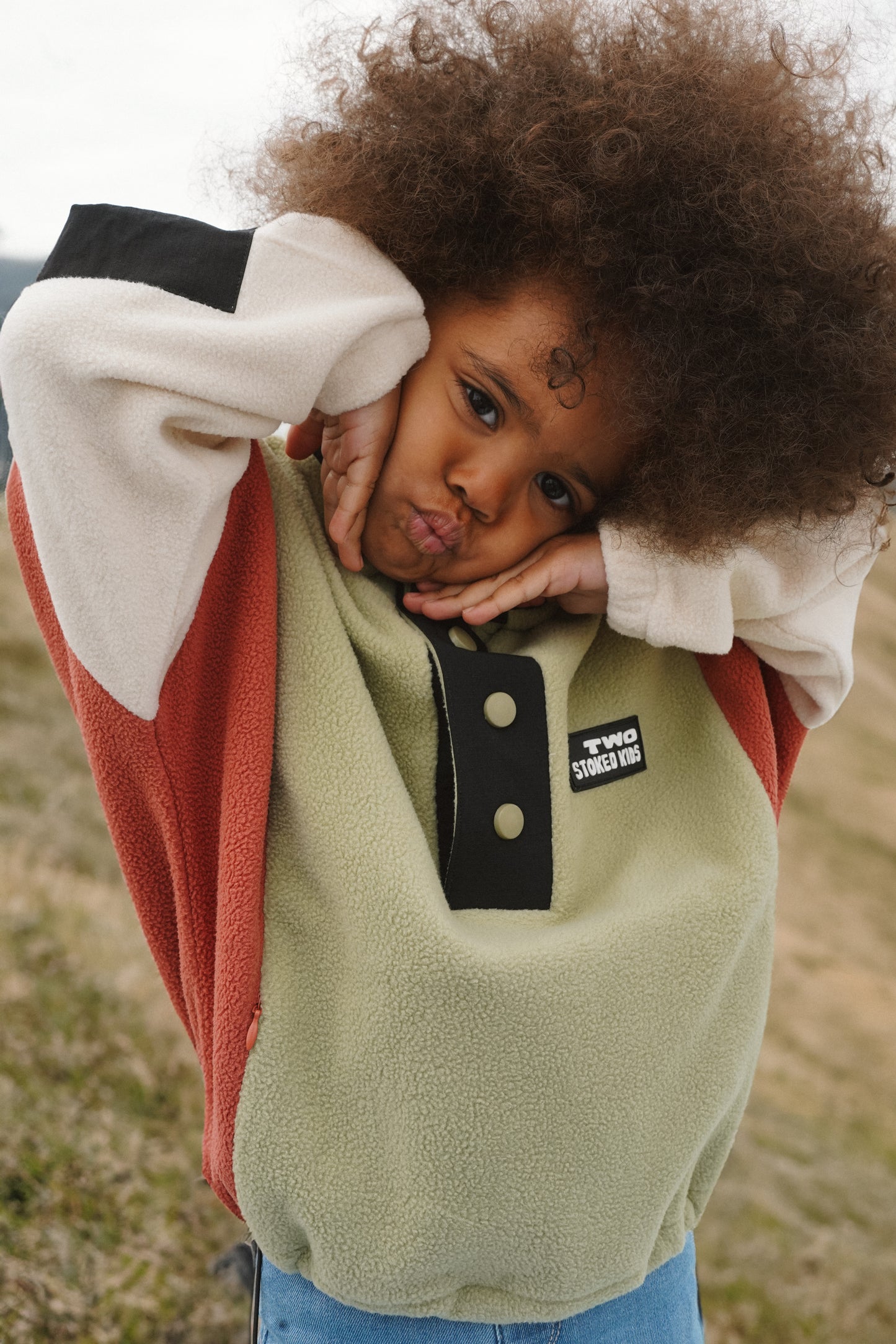Kids colorblock fleece pullover with large snap placket and contrast nylon sleeve detail