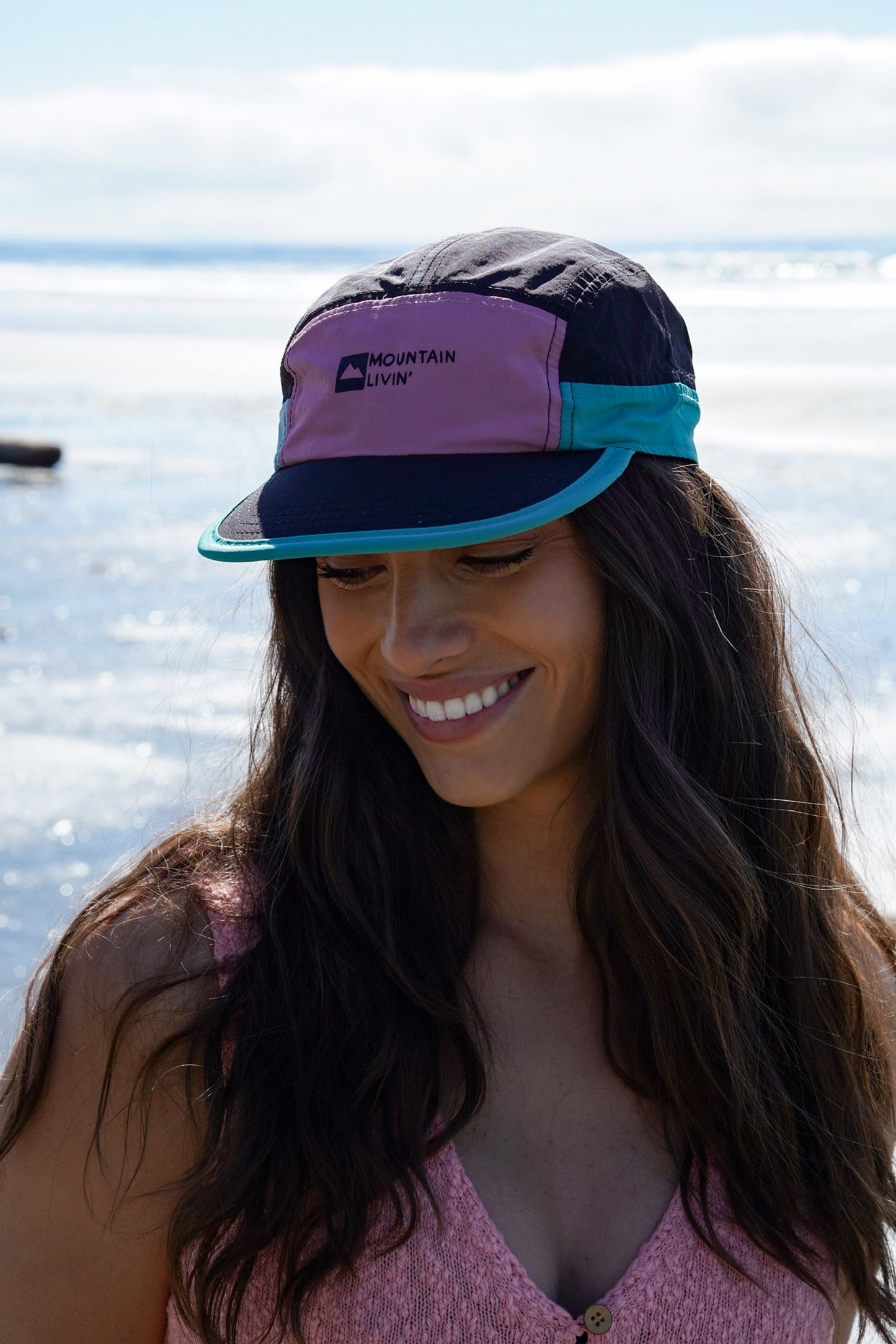 Woman wearing Adventure Awaits athletic cap with flat brim and lightweight design