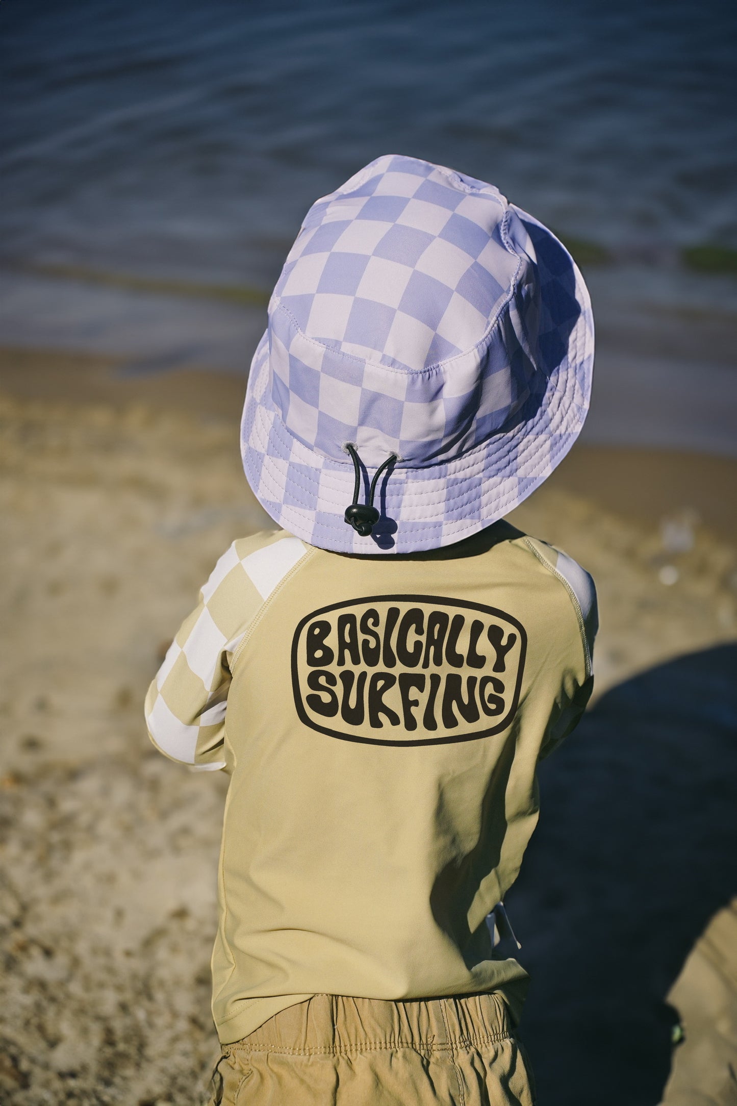 Kids Basically Surfing rashguard in checkered green and white with front zipper for summer water activities