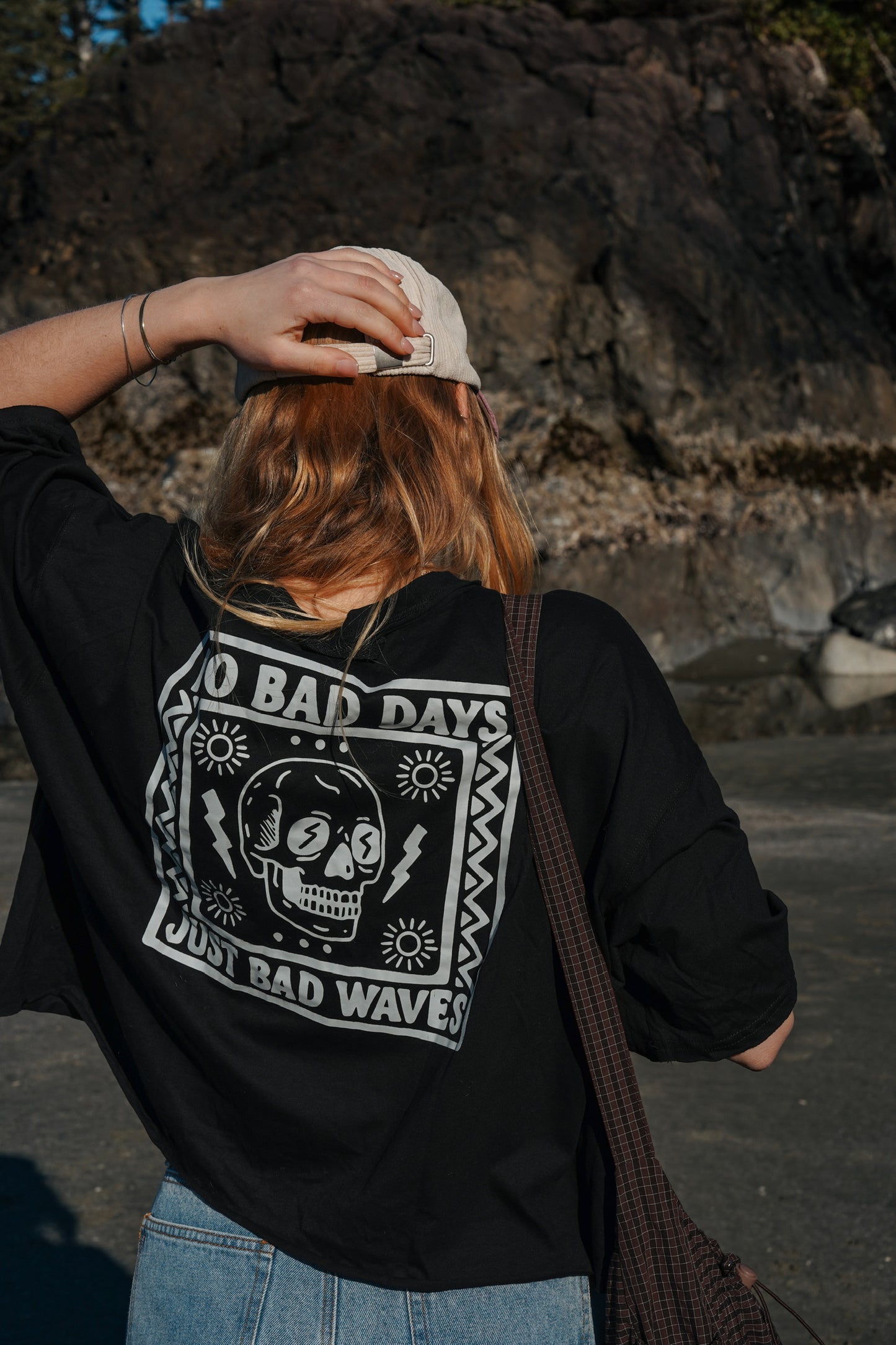 Women’s black cotton t-shirt with large graphic print on the back and relaxed fit perfect for surfers