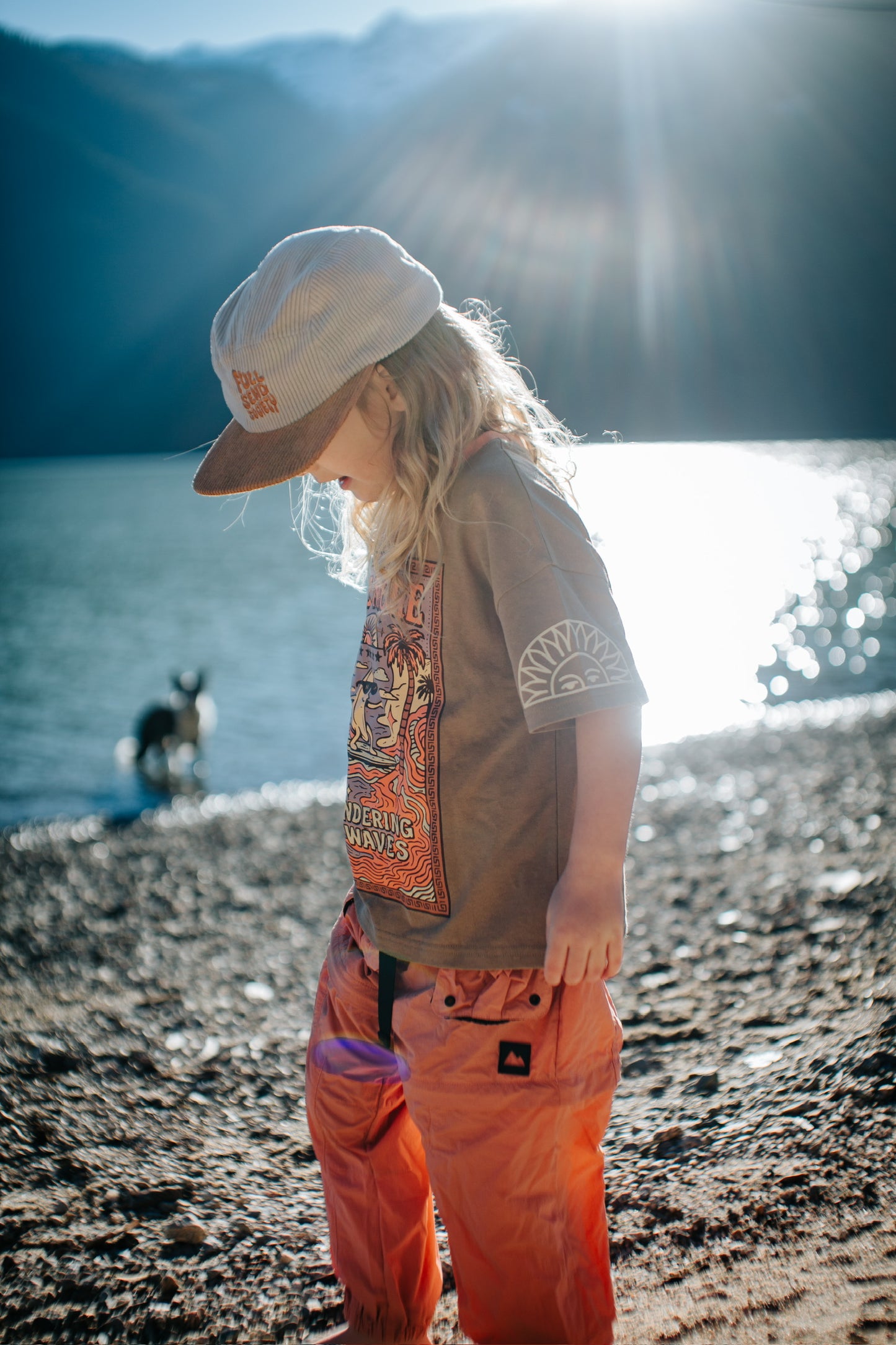 Child wearing brown cotton oversized tee with Surfing Banana print in a summer look