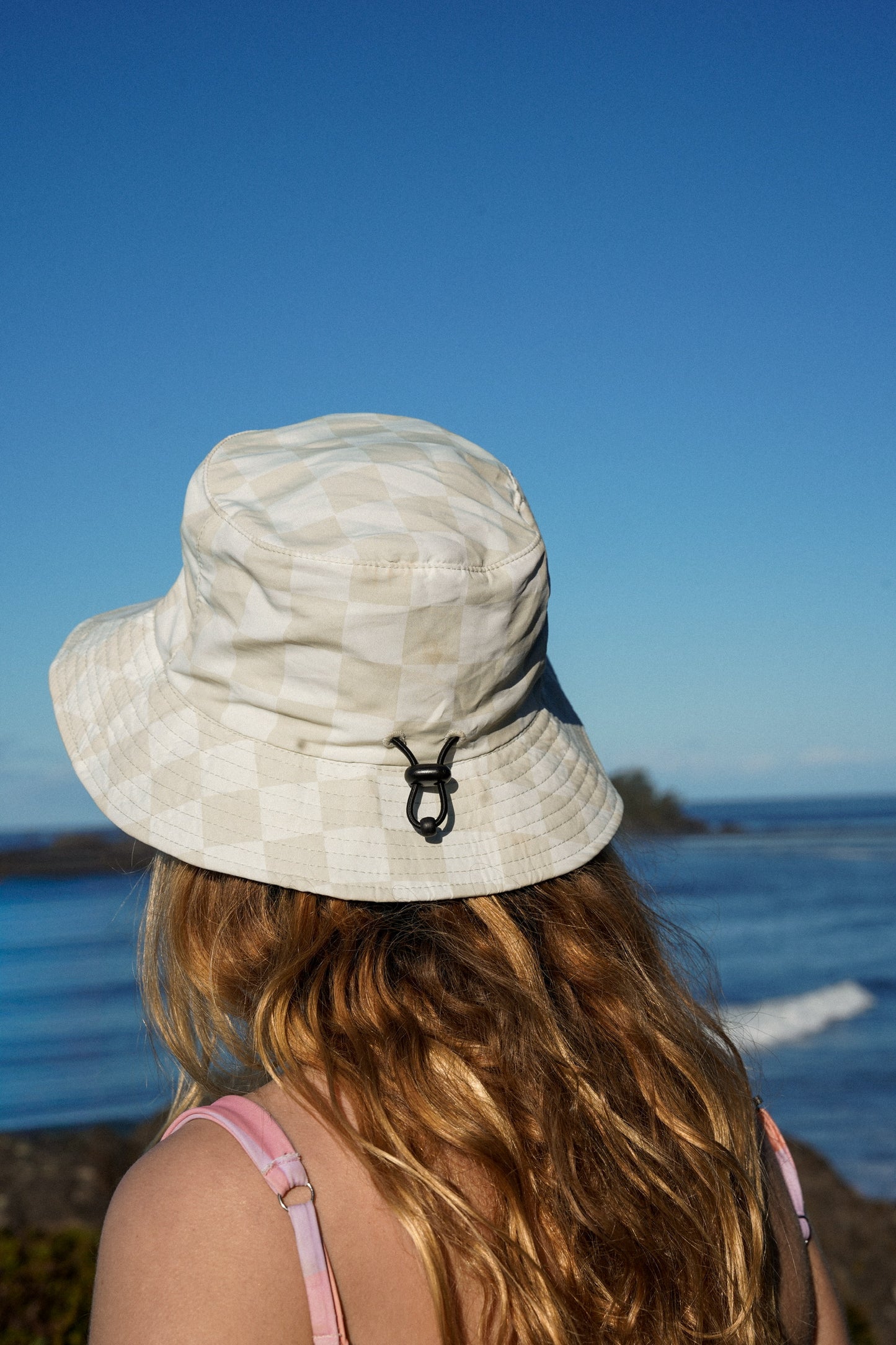 Unisex green checkered bucket hat with Good Life Club text designed for surf and summer use