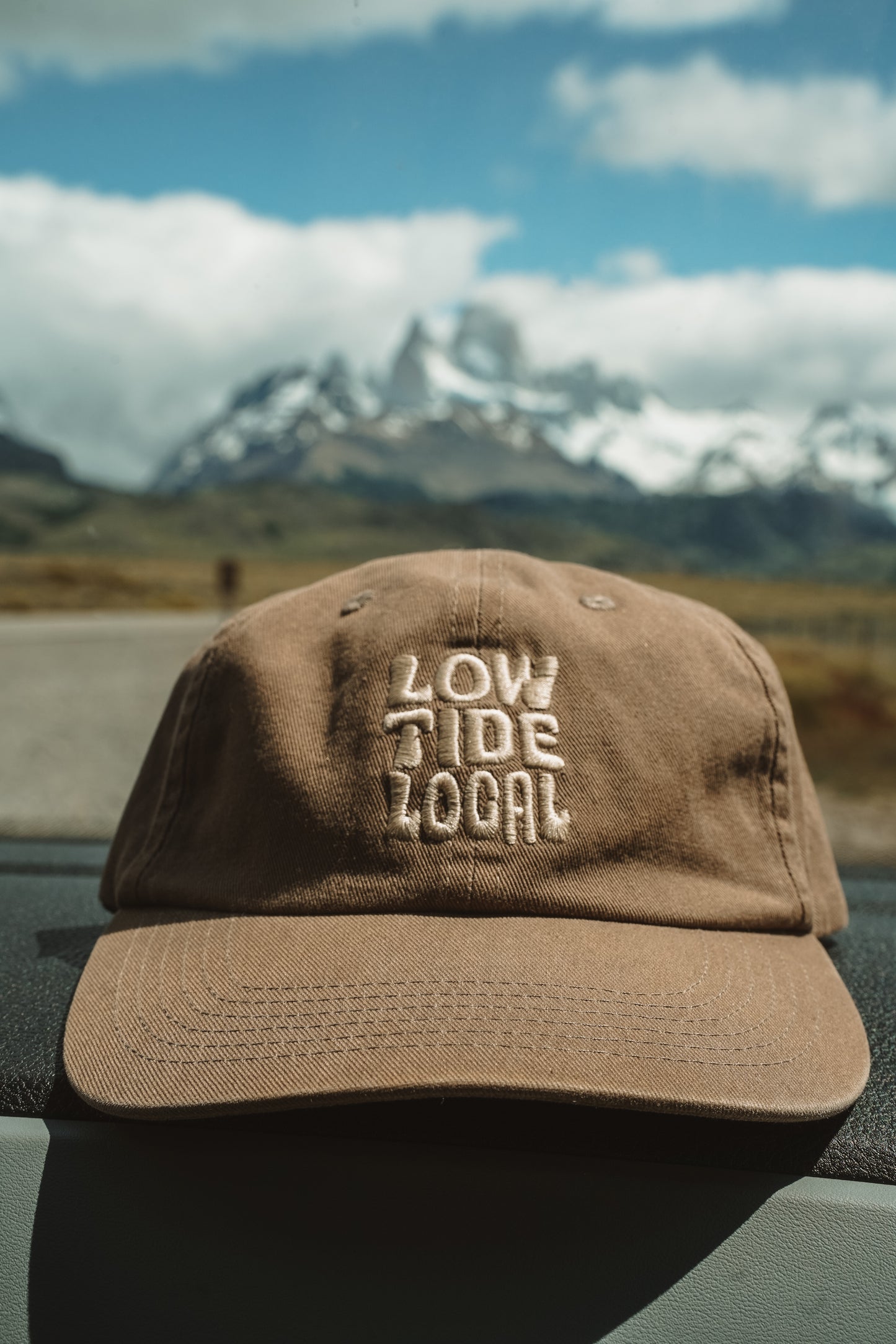 Lightly washed brown 6 panel cap with cream Love Tide Local embroidery, adjustable strap, 100% cotton