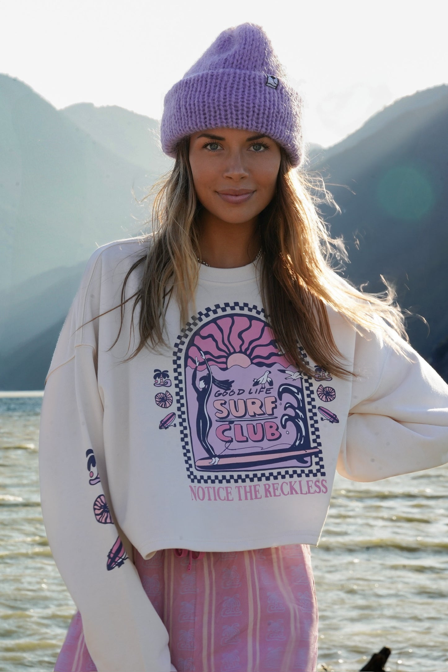 Off white cotton cropped long sleeve top with graphic print styled for a relaxed mountain adventure vibe