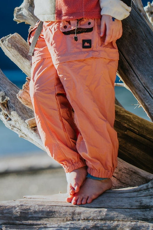 Kids dusty coral zip-off hiking pants with cargo pockets and adjustable waistband