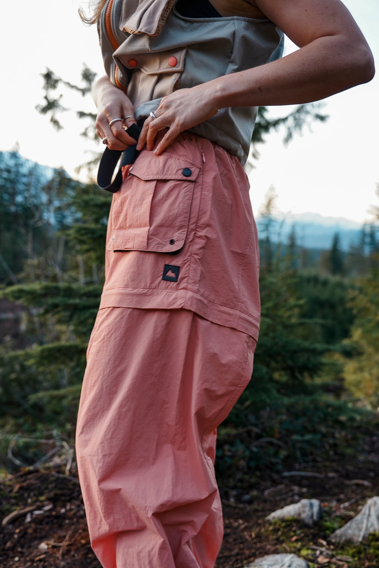 Women's dusty coral zip-off hiking pants with side cargo pocket and adjustable waistband