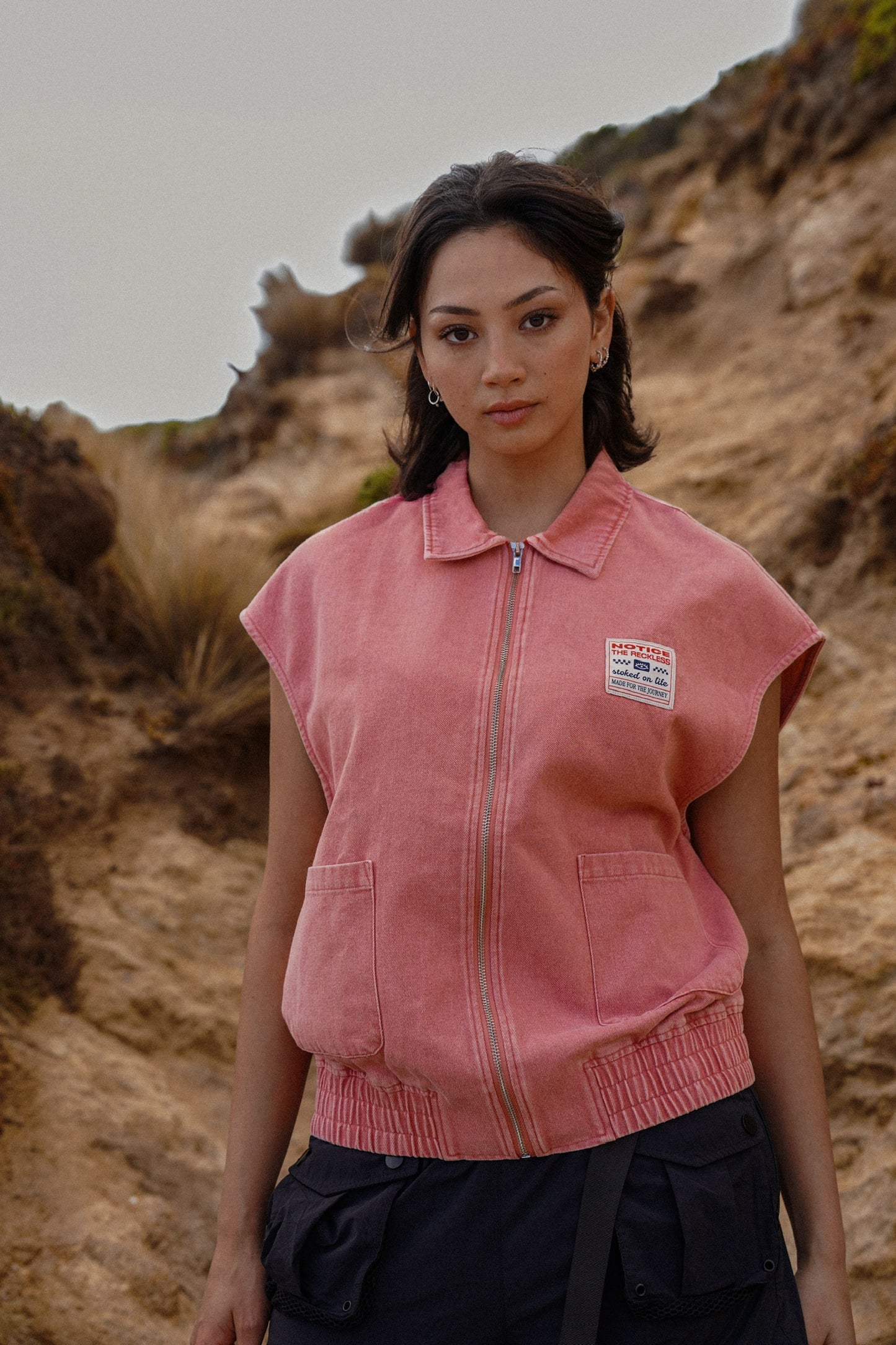 Women’s dusty pink denim vest with zipper front and sleeveless design for summer