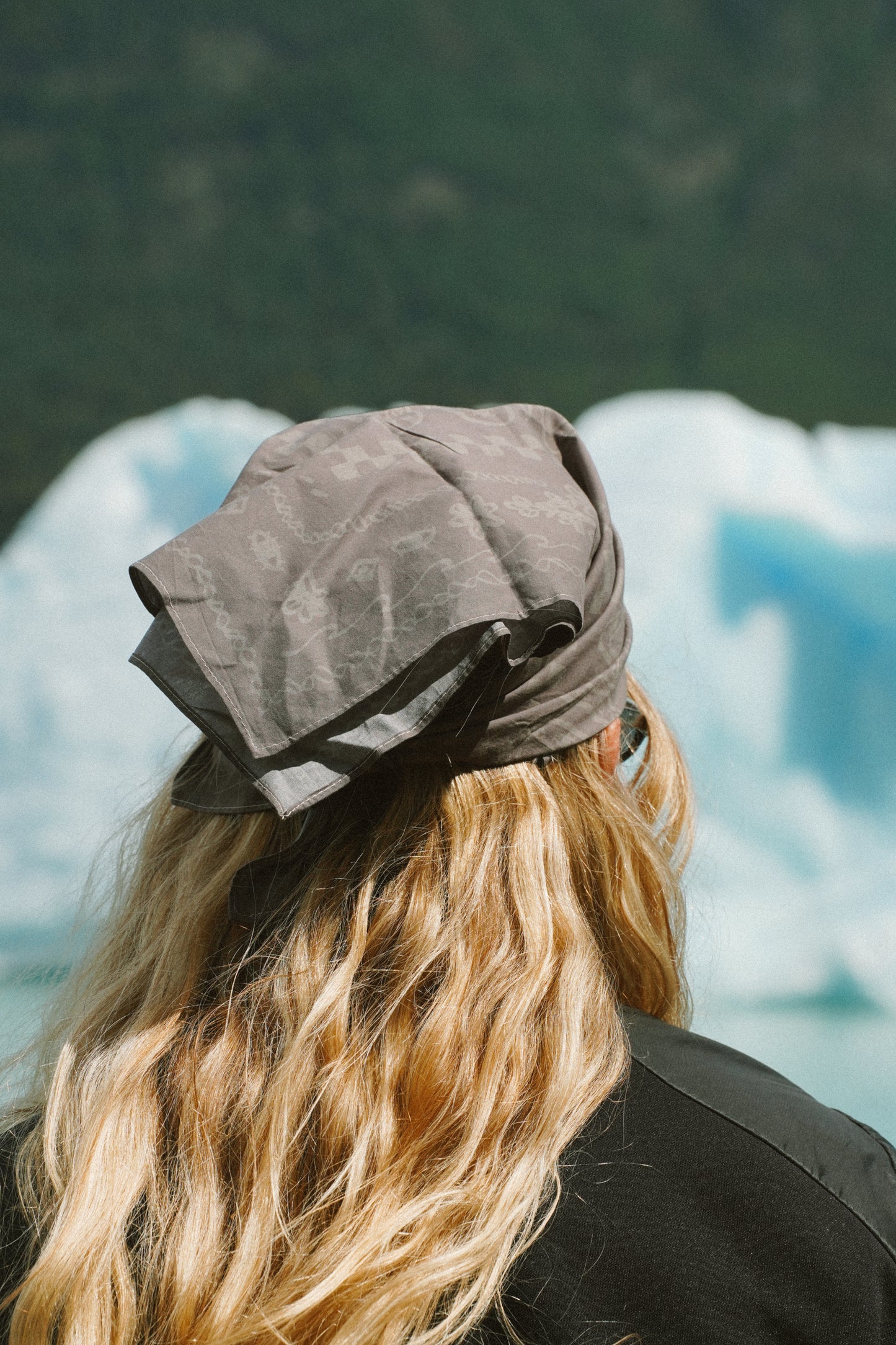 Dark grey 100% cotton bandana tied as a head wrap for hiking