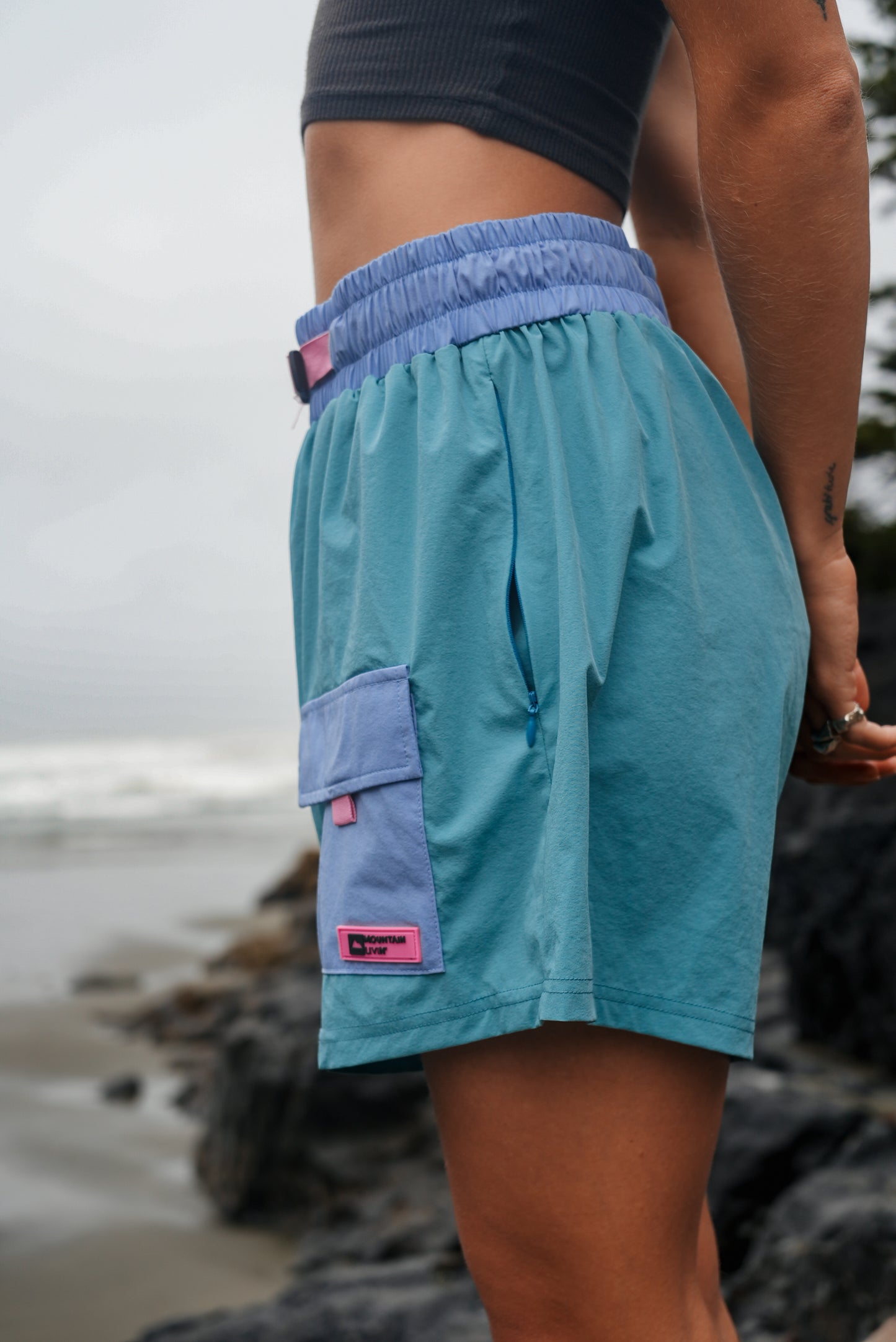 Women’s blue-green cotton Highland Trek shorts designed for summer hiking and outdoor activities