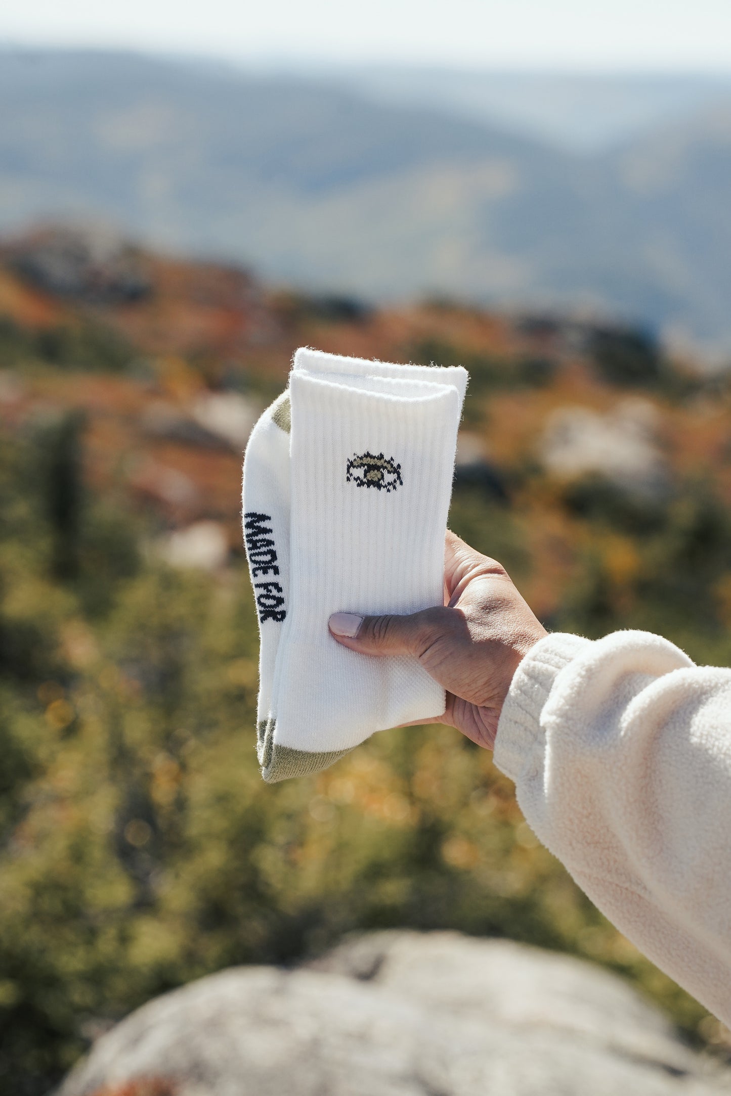 Merino wool hiking crew socks with flower and nature-inspired embroidered designs