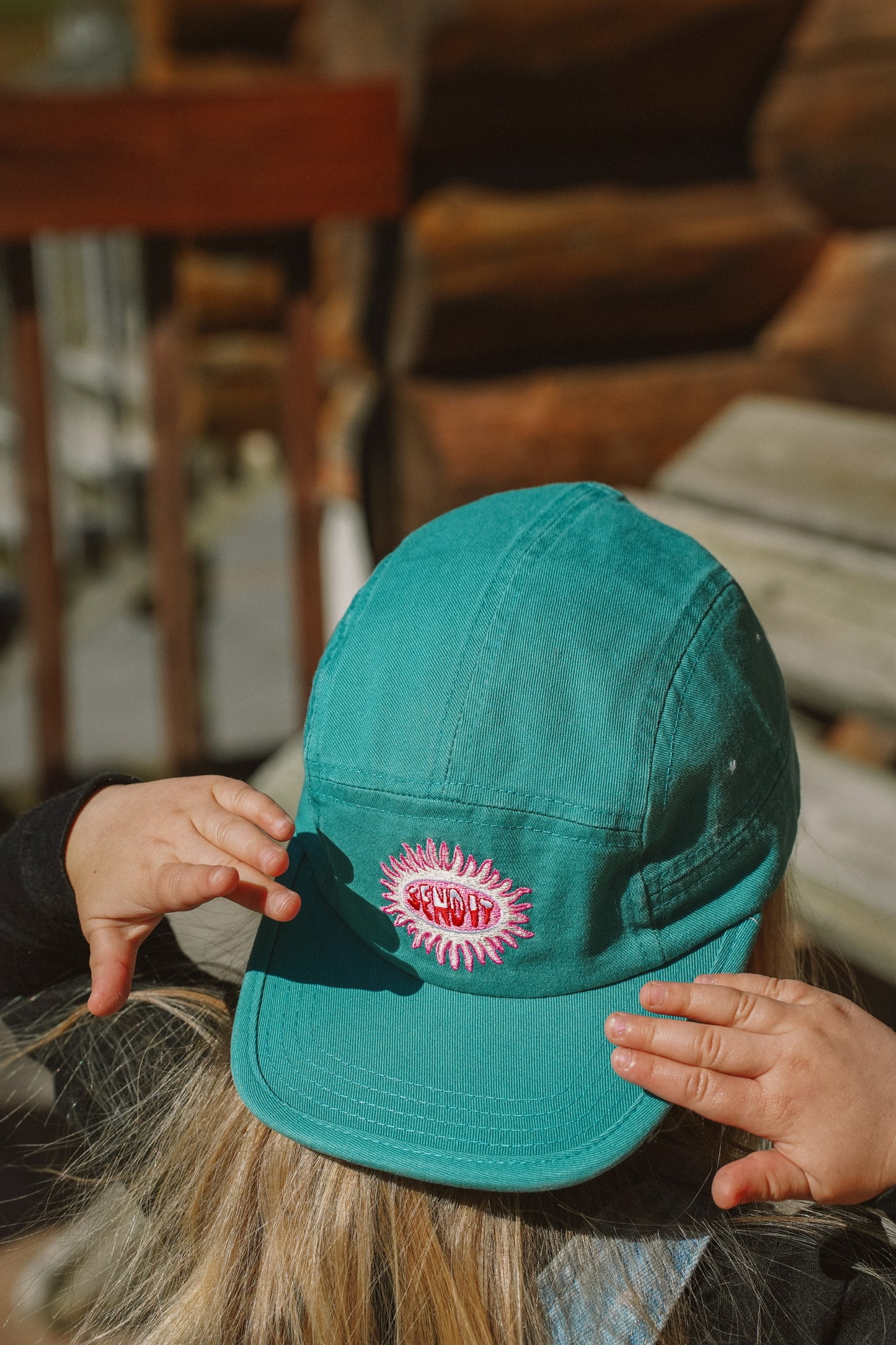 Child wearing Surfline kids 5 panel cotton hat in a casual summer style