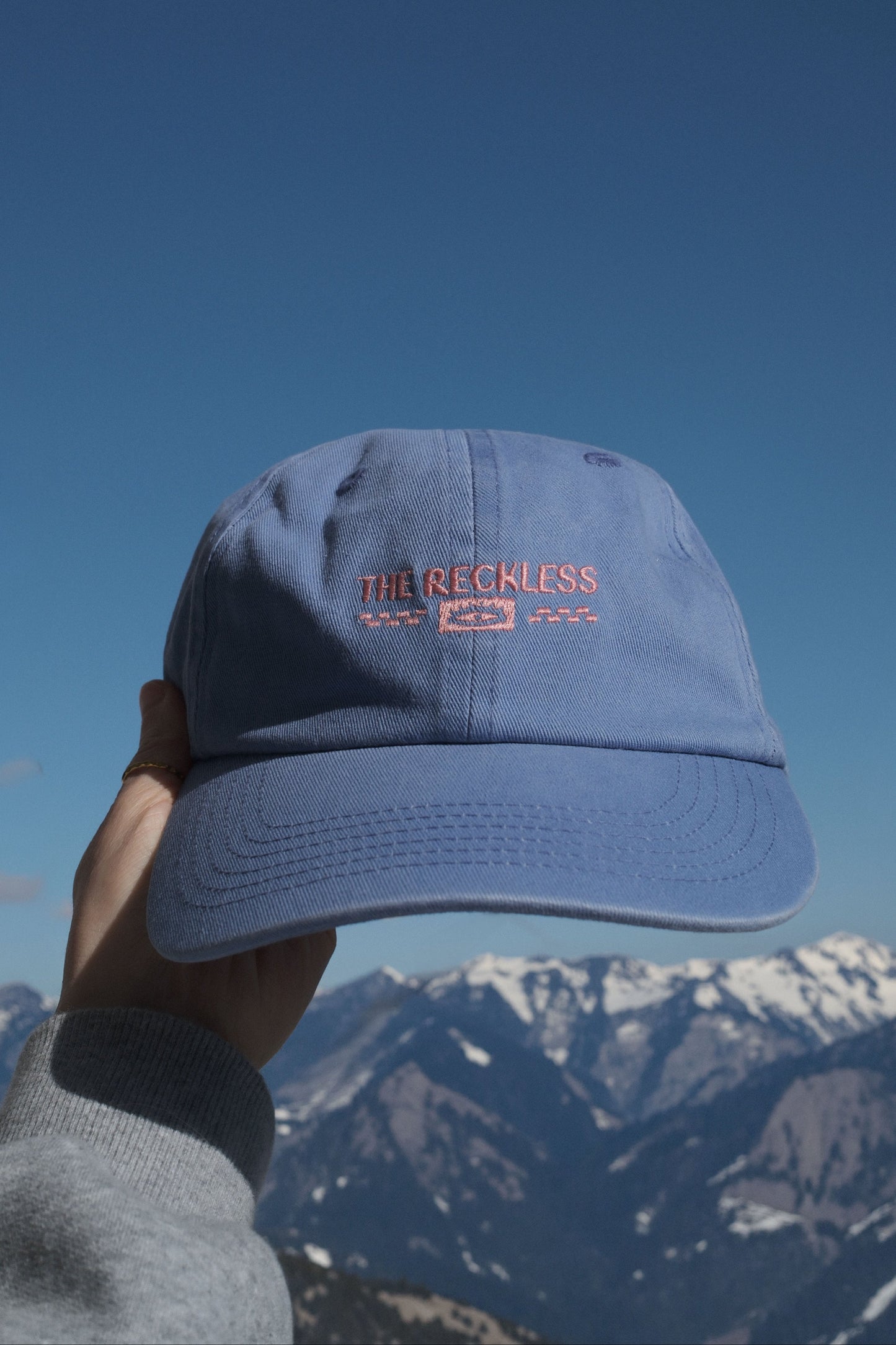 Blue cotton dad hat with front embroidery and adjustable back strap