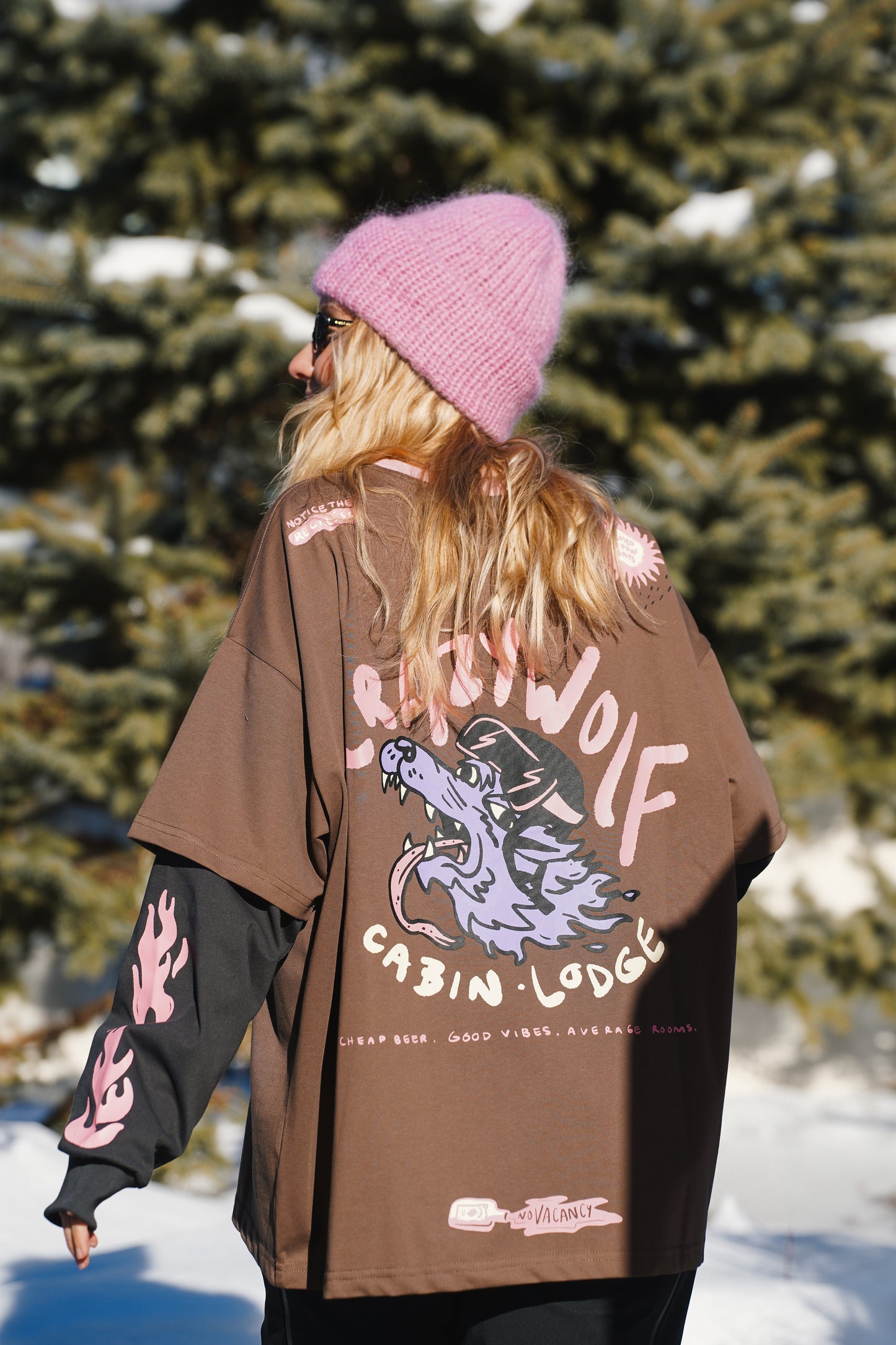 Women’s 100% cotton layered long sleeve shirt featuring wolf graphic print, brown body, black sleeves and pink neckline detail