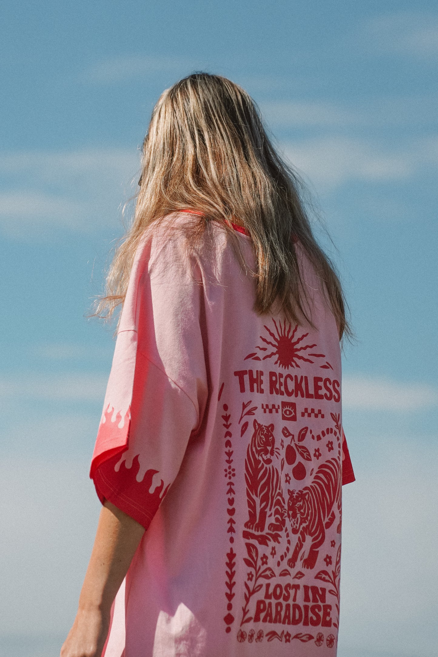 Women’s pink cotton tee dress with long sleeves and red flames design for summer