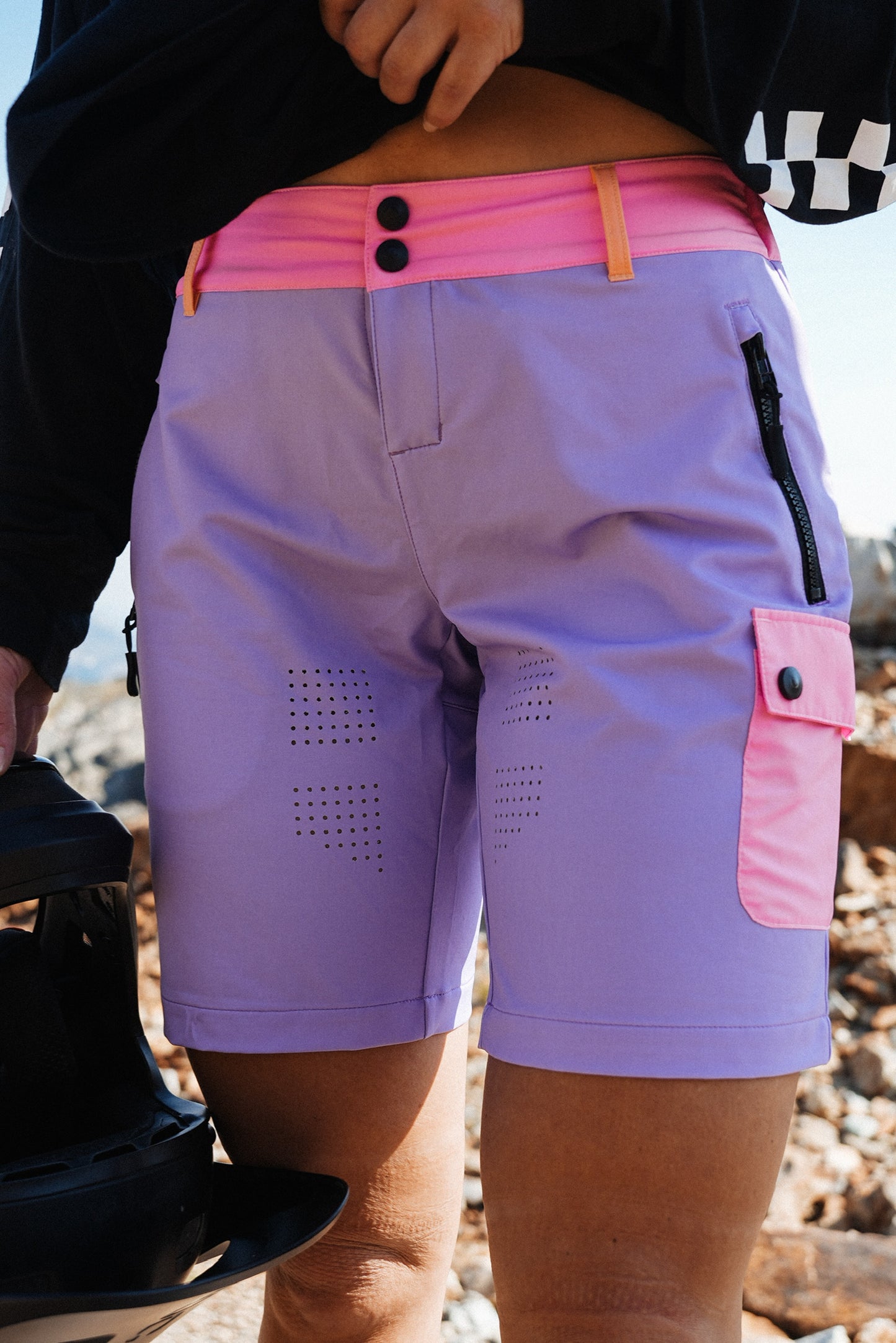 Mountain bike shorts for women in purple and pink with zip pockets and technical performance fabric