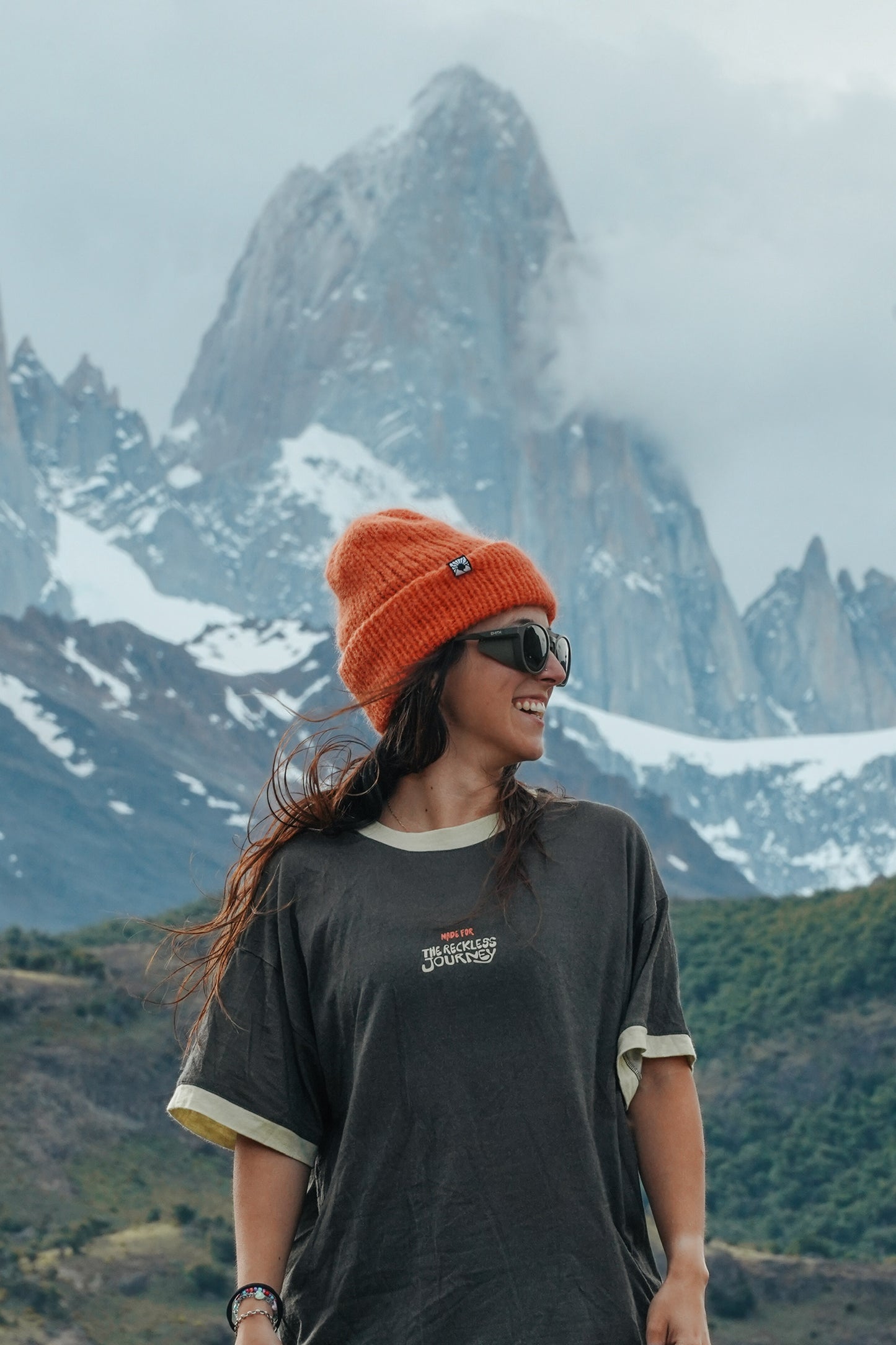 Women's charcoal merino wool hiking t-shirt with green collar and sleeve hems