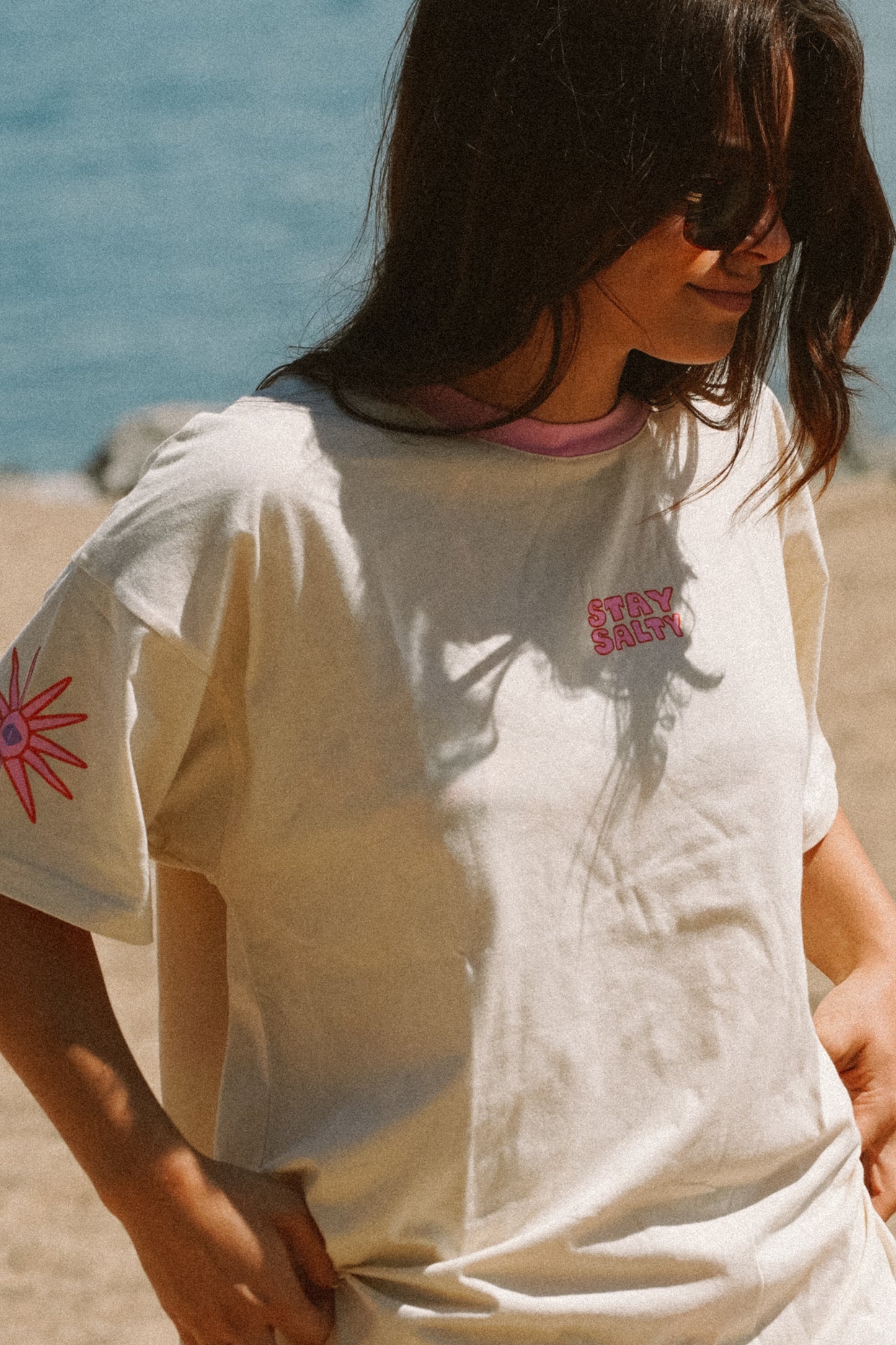 Women’s oversized cotton tee with Stay Salty design in a relaxed summer beach style