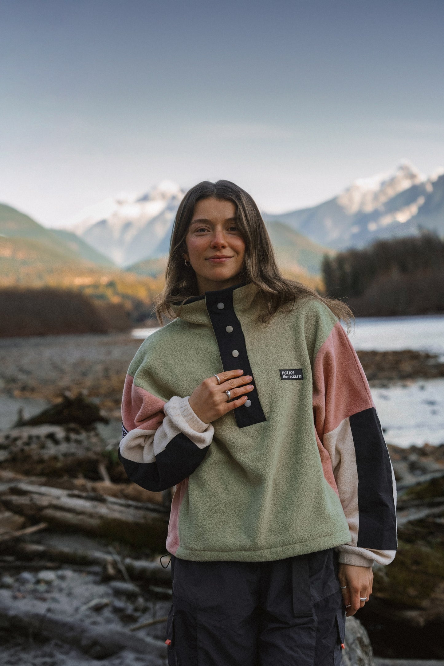 Women's colorblock cropped fleece pullover with snap placket and contrast sleeves