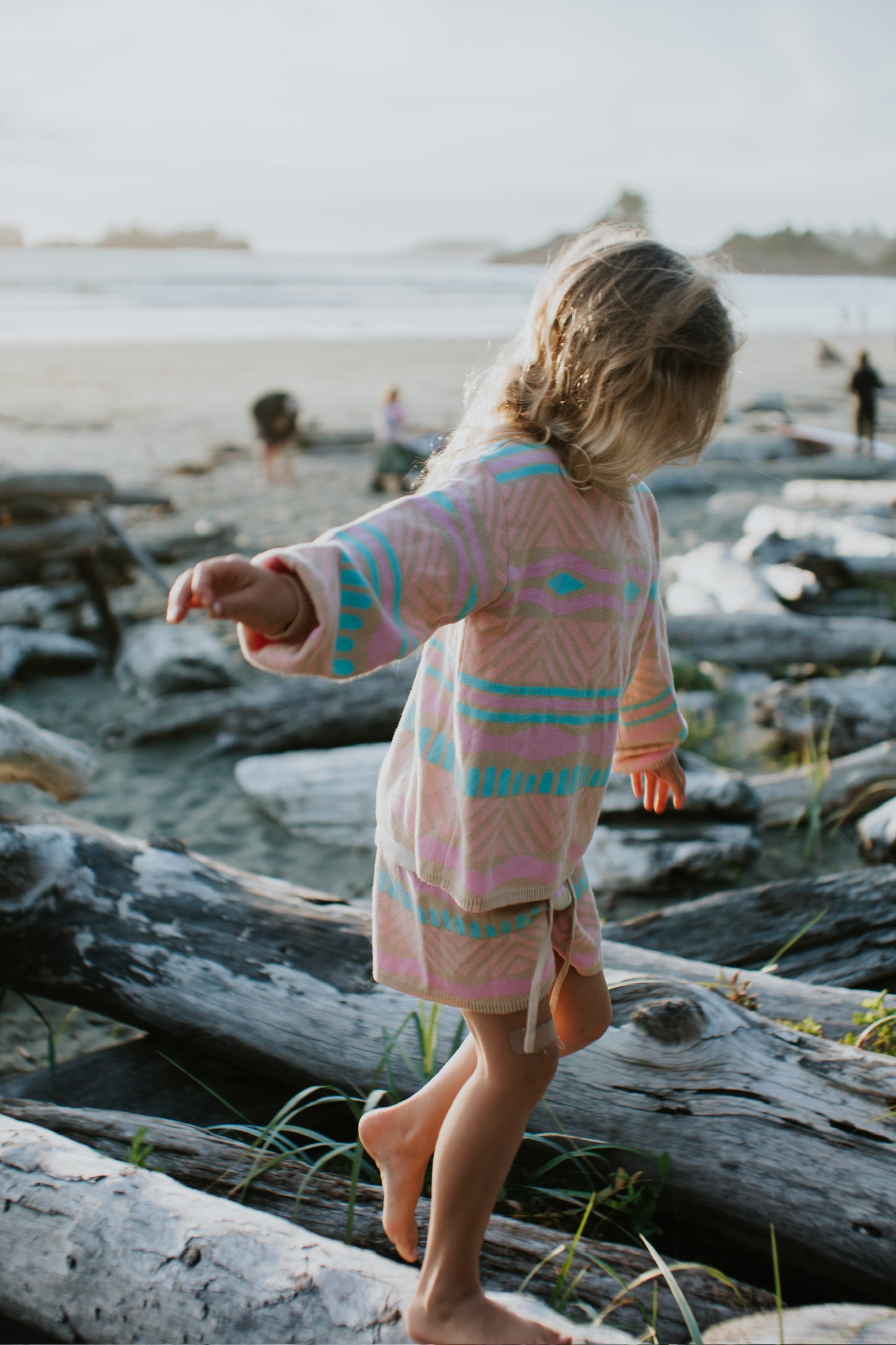 Kids Paradise Island cotton shorts in sand with coral, aqua, and bubblegum pattern for summer wear