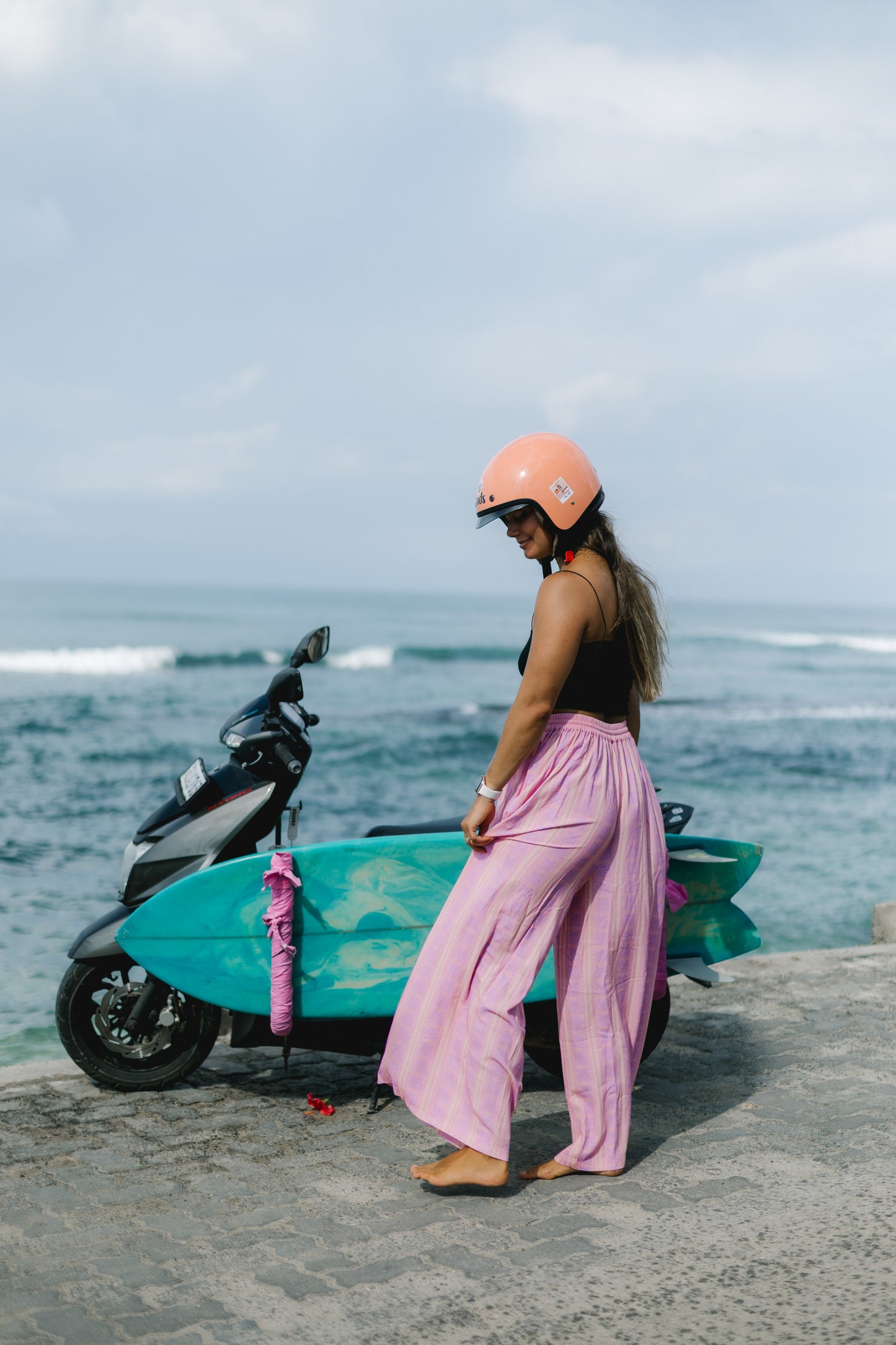 Pink linen boho pants for adventurous beach days, perfect for a relaxed after surf summer vibe