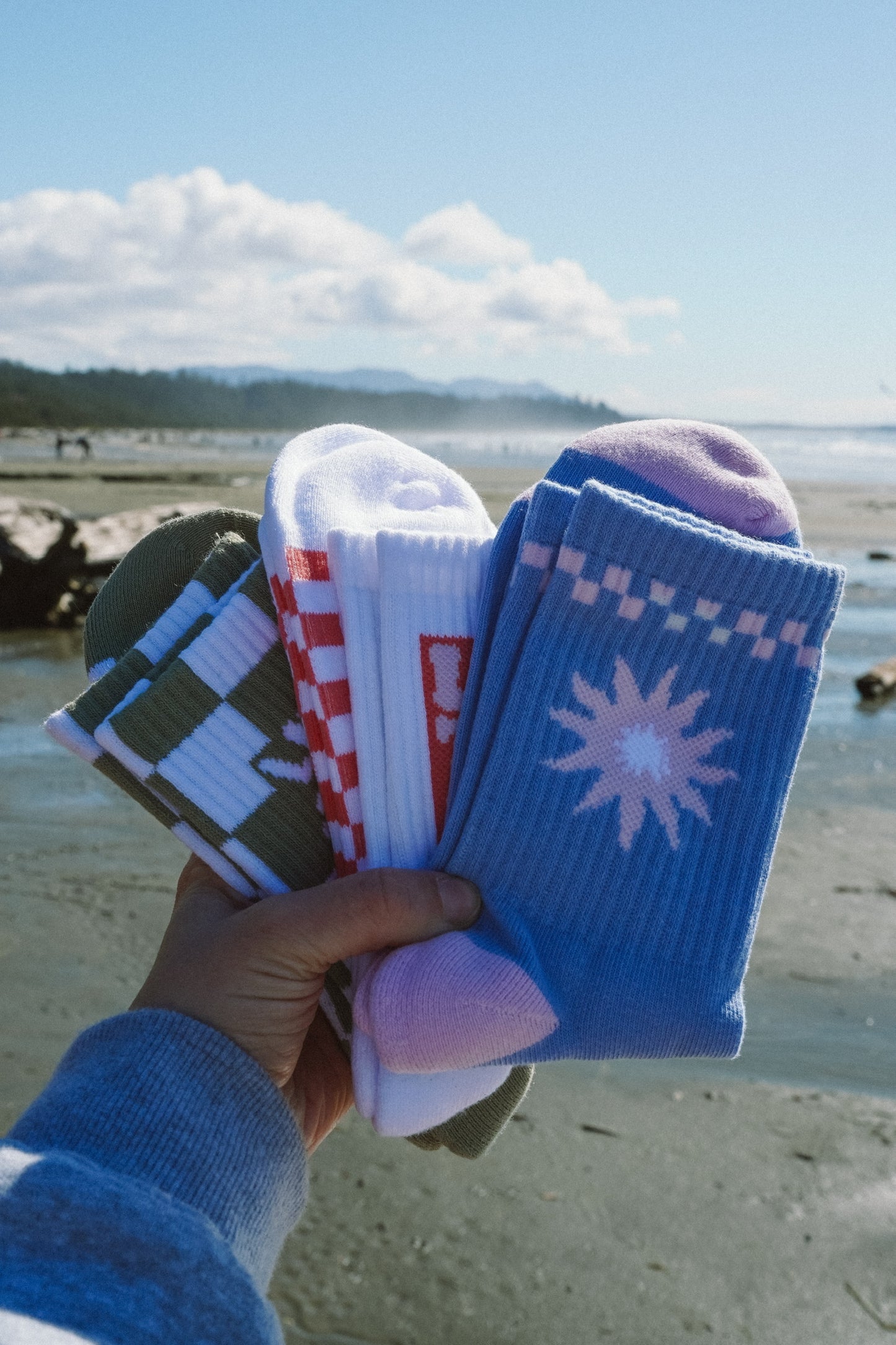 Three pairs of unisex ankle socks in green, white, and blue checkered designs
