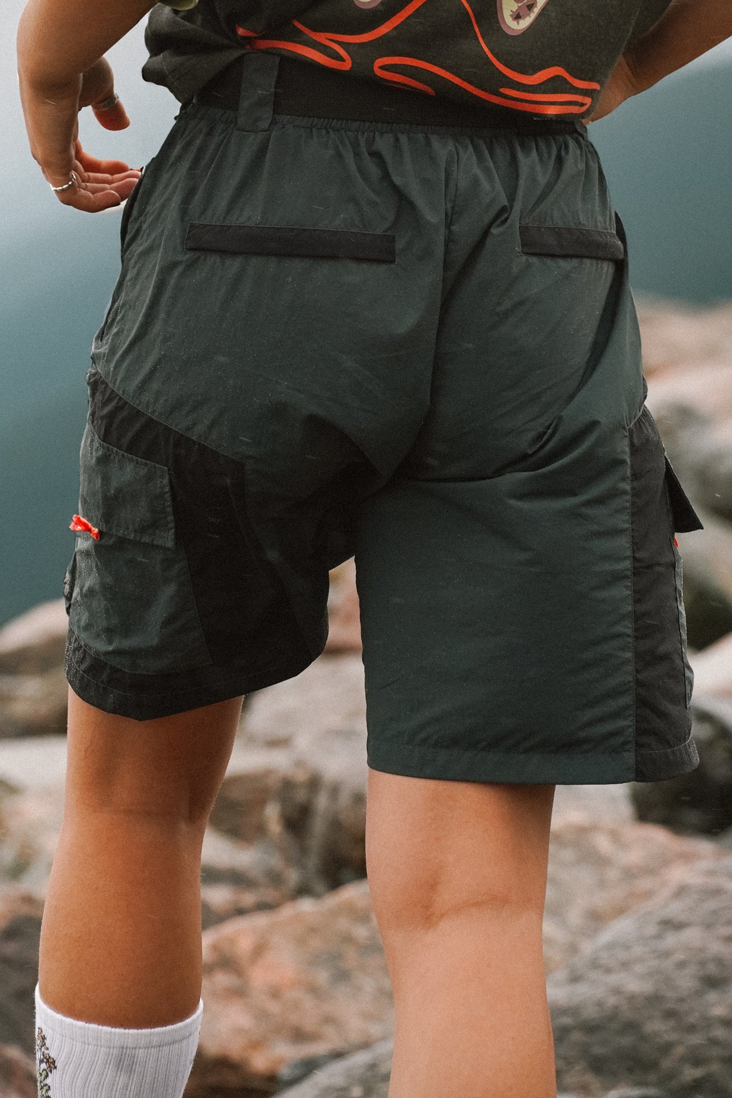 Back view of women's Reckless hiking shorts in grey with rear pockets