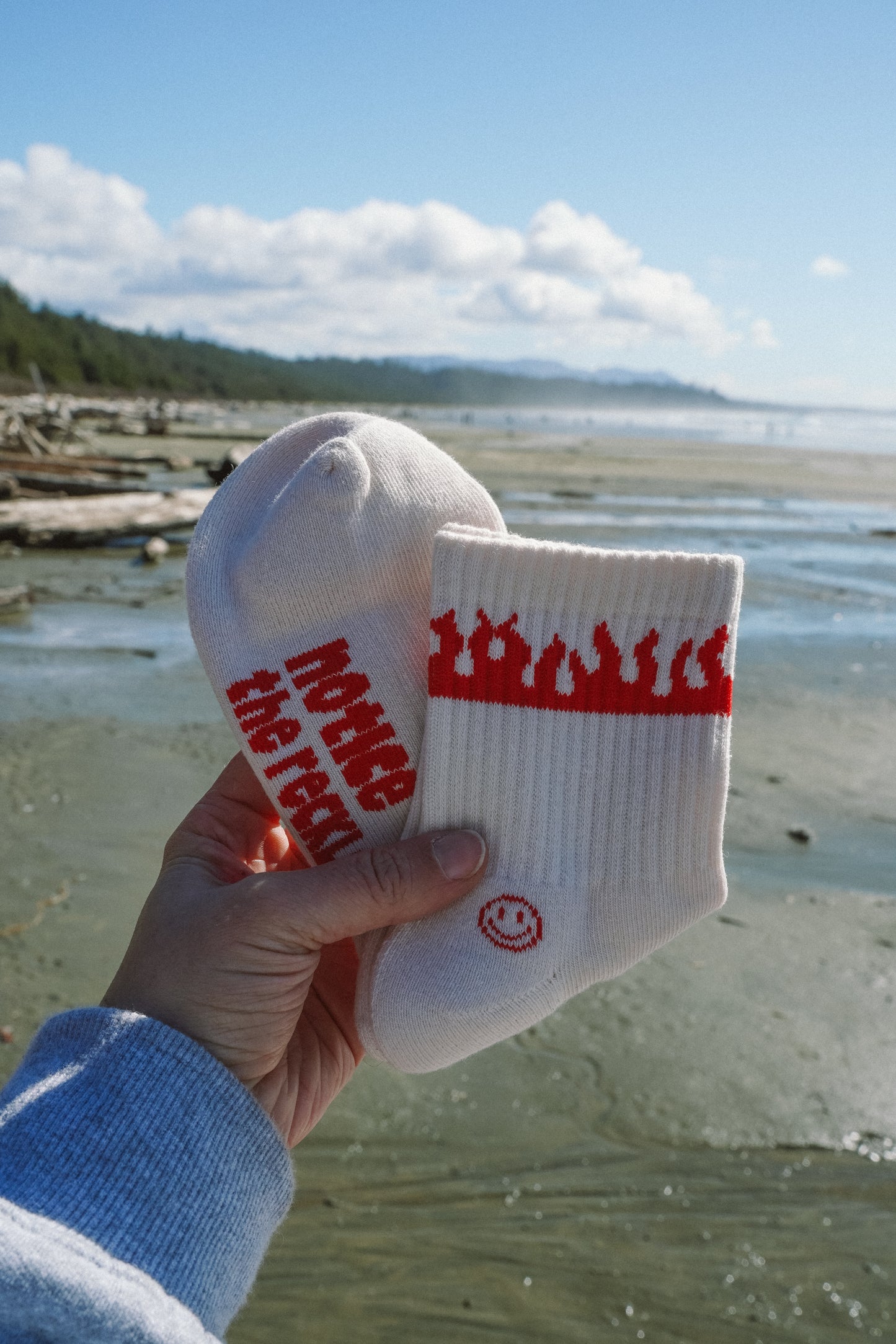 White Solstice Socks crew socks with red graphic detailing, designed for everyday wear