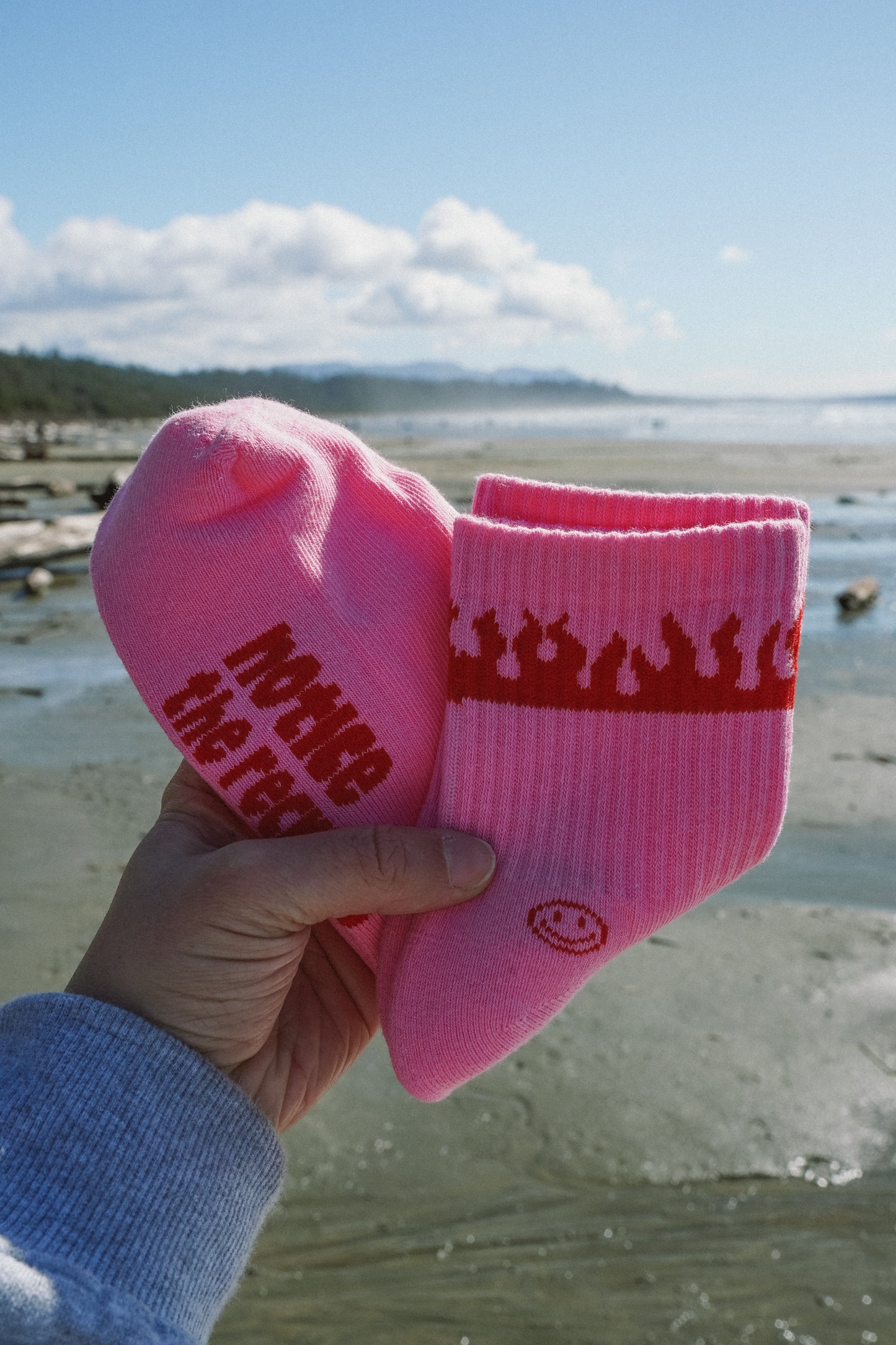Pink Solstice Socks crew socks featuring a contrasting logo design, one-size fits 7–11