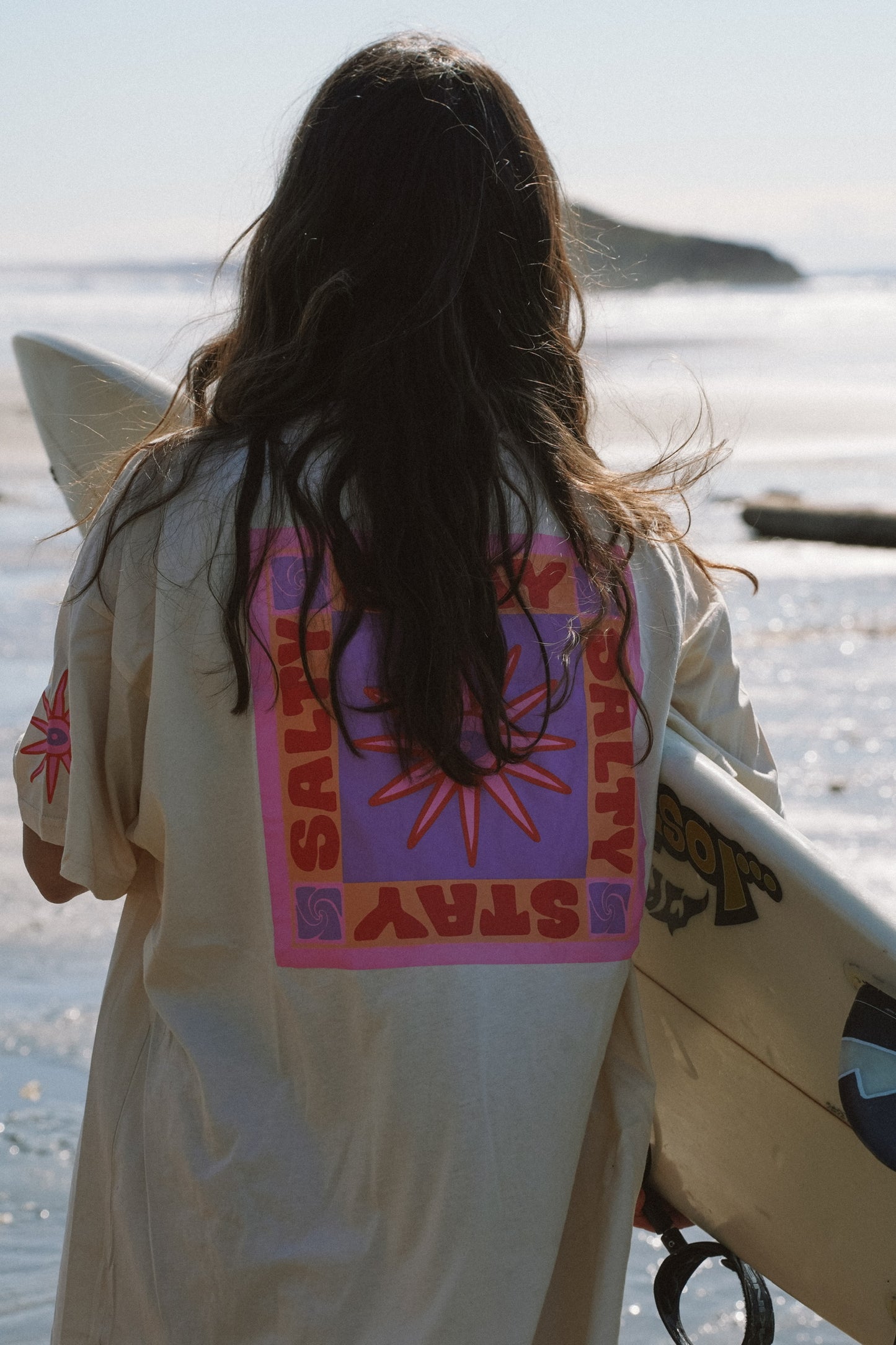 Women’s ivory cotton oversized tee with Stay Salty print in a surf beach summer style