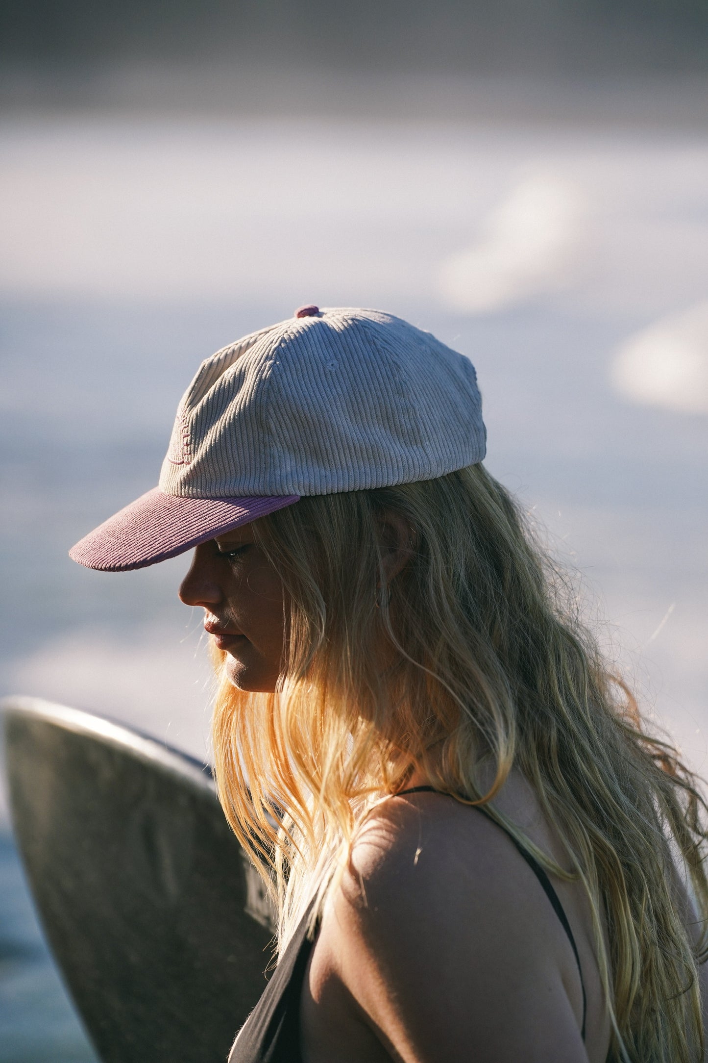 Unisex lilac and sand cap with embroidered logo and lightweight summer design