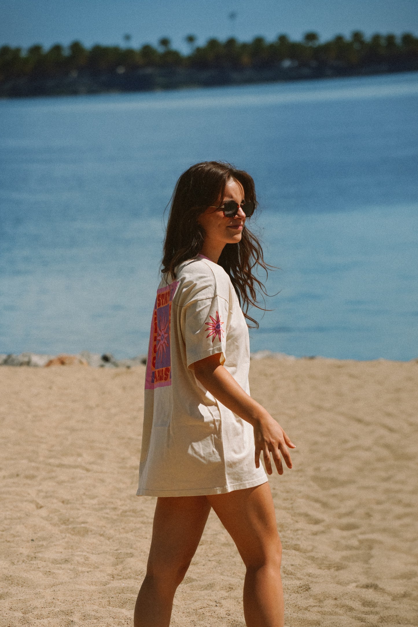 Ivory cotton oversized t-shirt with graphic print designed for summer surf and beach wear