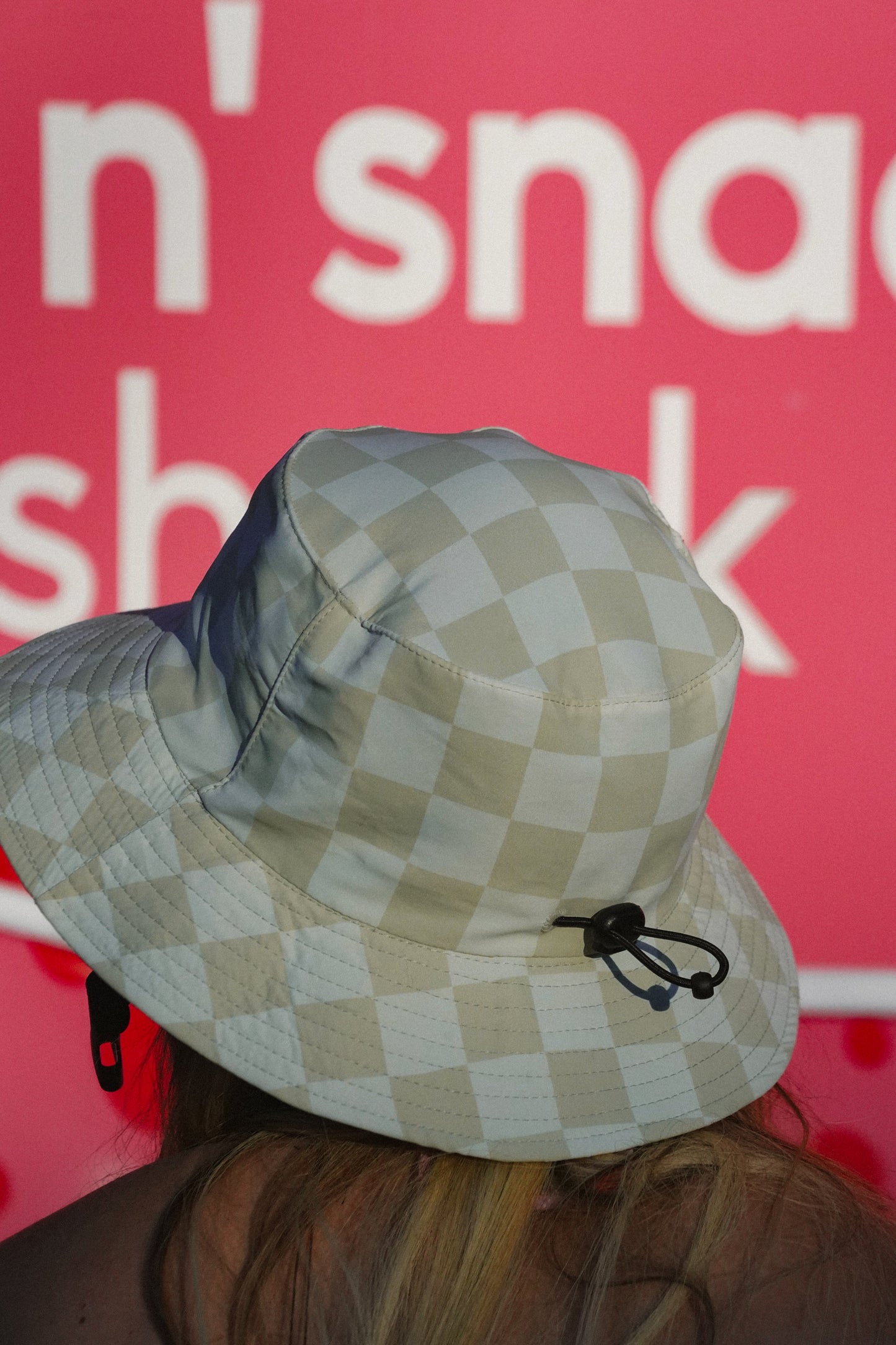 Surf style bucket hat with green checkered pattern and Good Life Club logo for summer