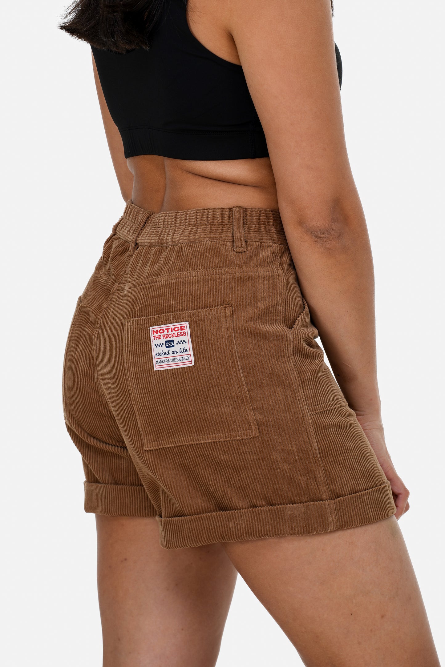 Brown corduroy shorts with zip fly, button closure, and functional pockets for summer