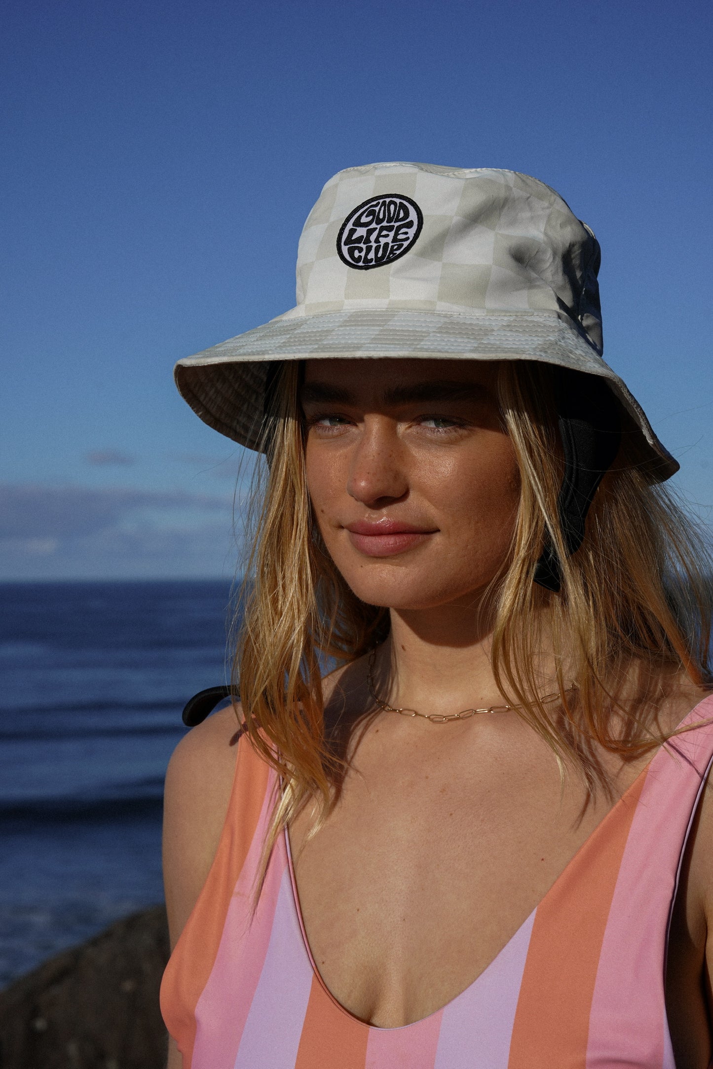 Checkered green surfing bucket hat with Good Life Club embroidery and summer style