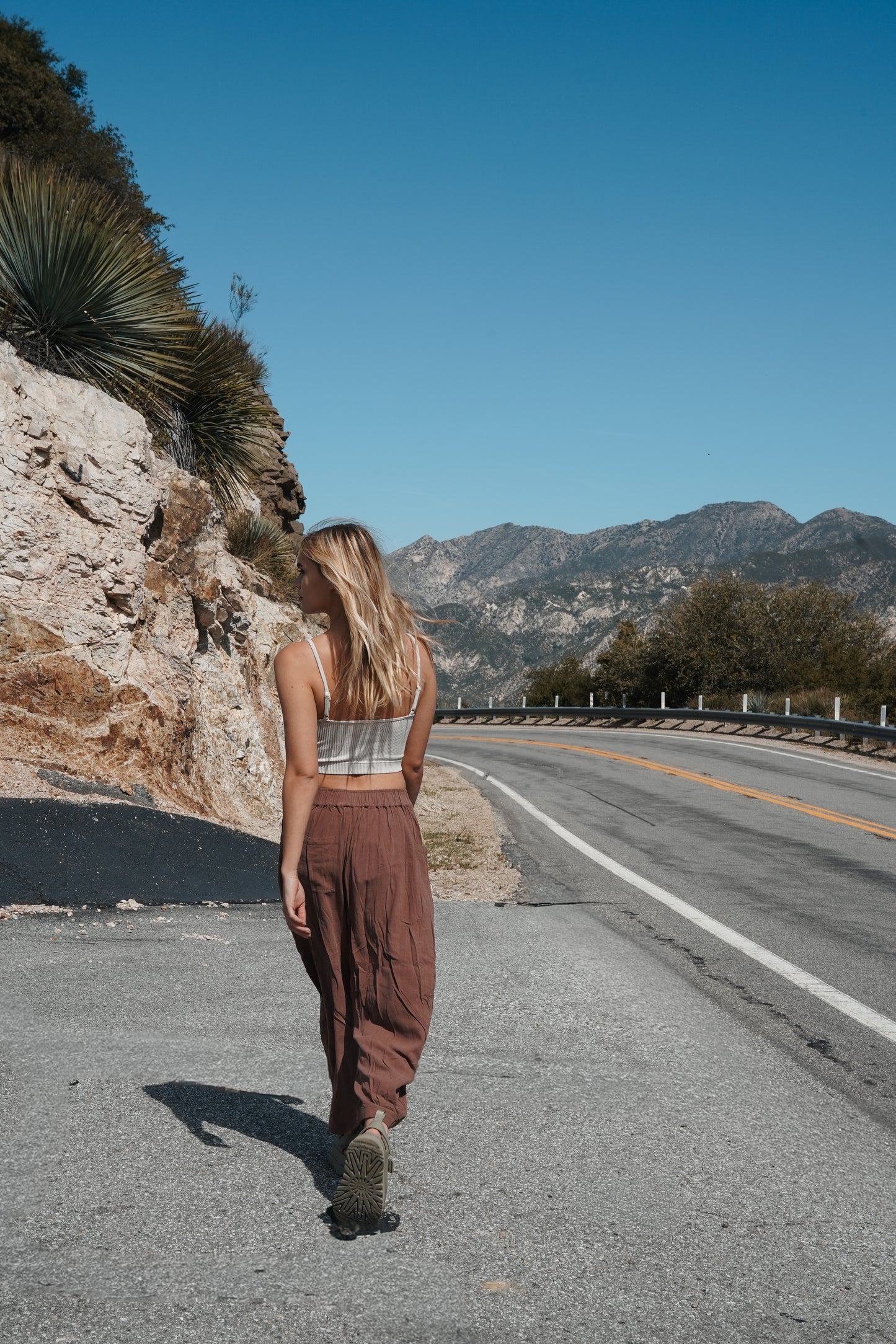 Women's wide-leg linen barrel trousers in a rich brown shade, designed for breathable comfort and effortless sunset-inspired styling