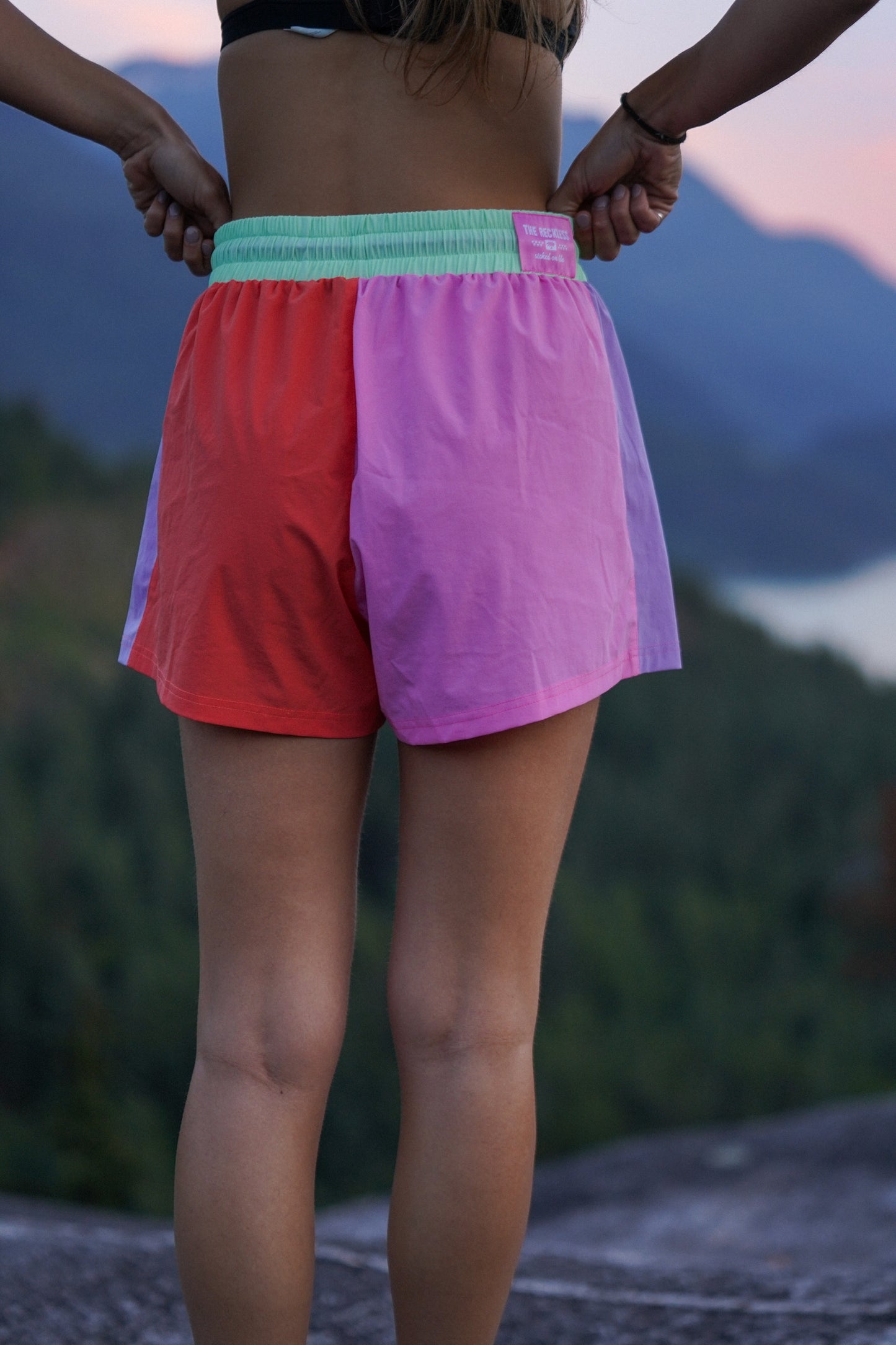 Colorful women’s shorts with adjustable cord and zip pockets in a surf summer look