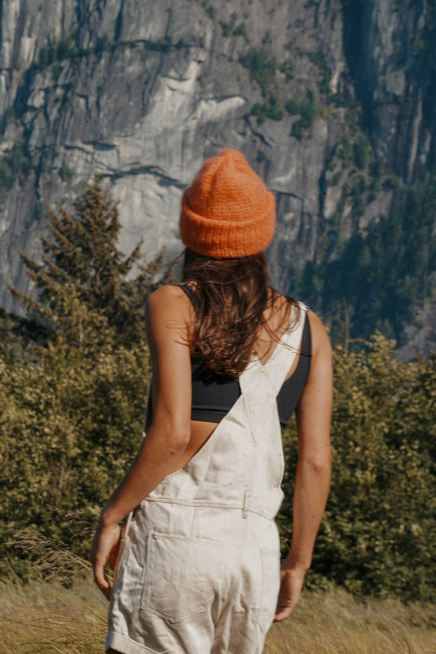 Beige cotton short overalls with chest pocket and cuffed hem for summer wear