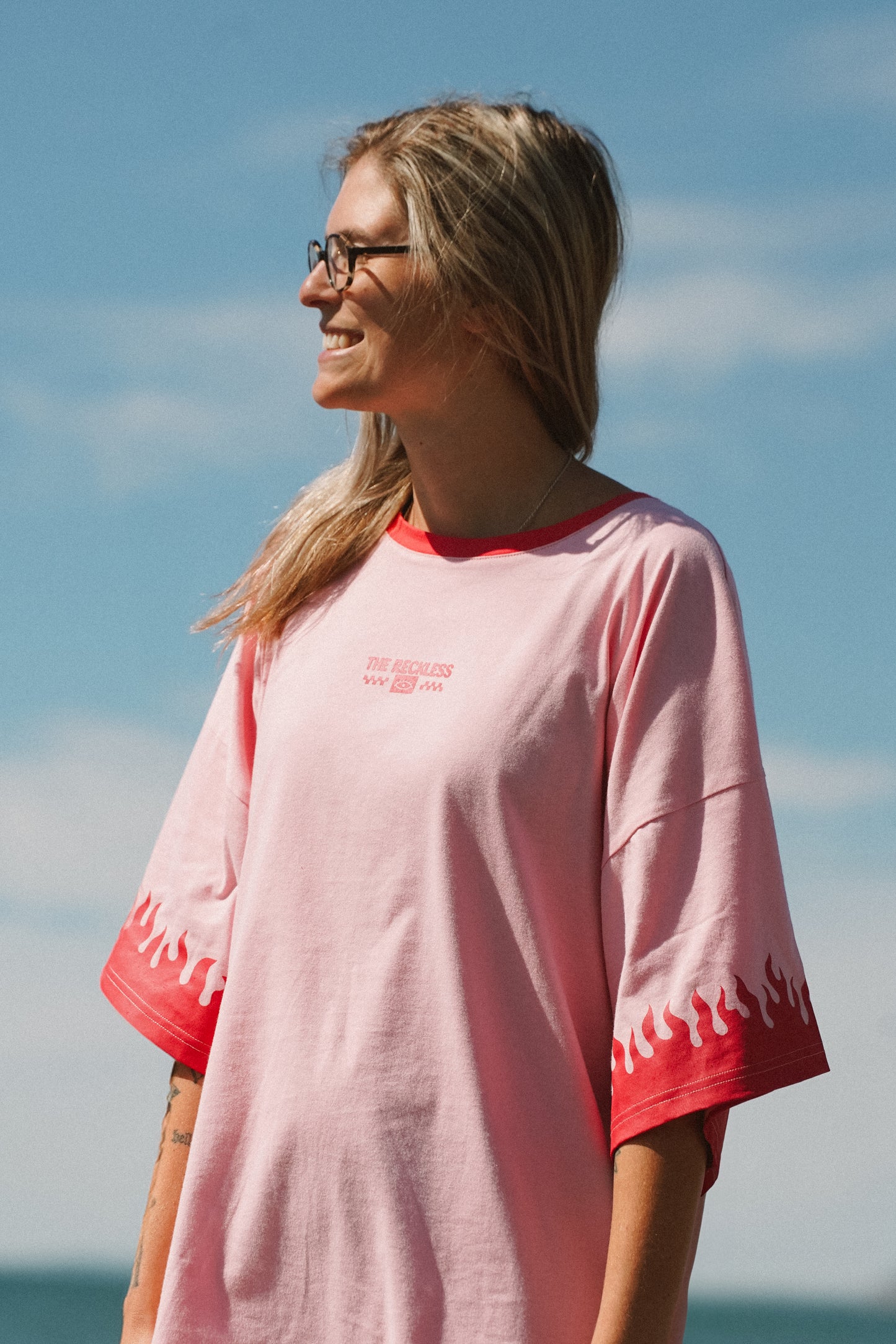 Pink cotton T-shirt dress with flames graphic print on front, back, and sleeves