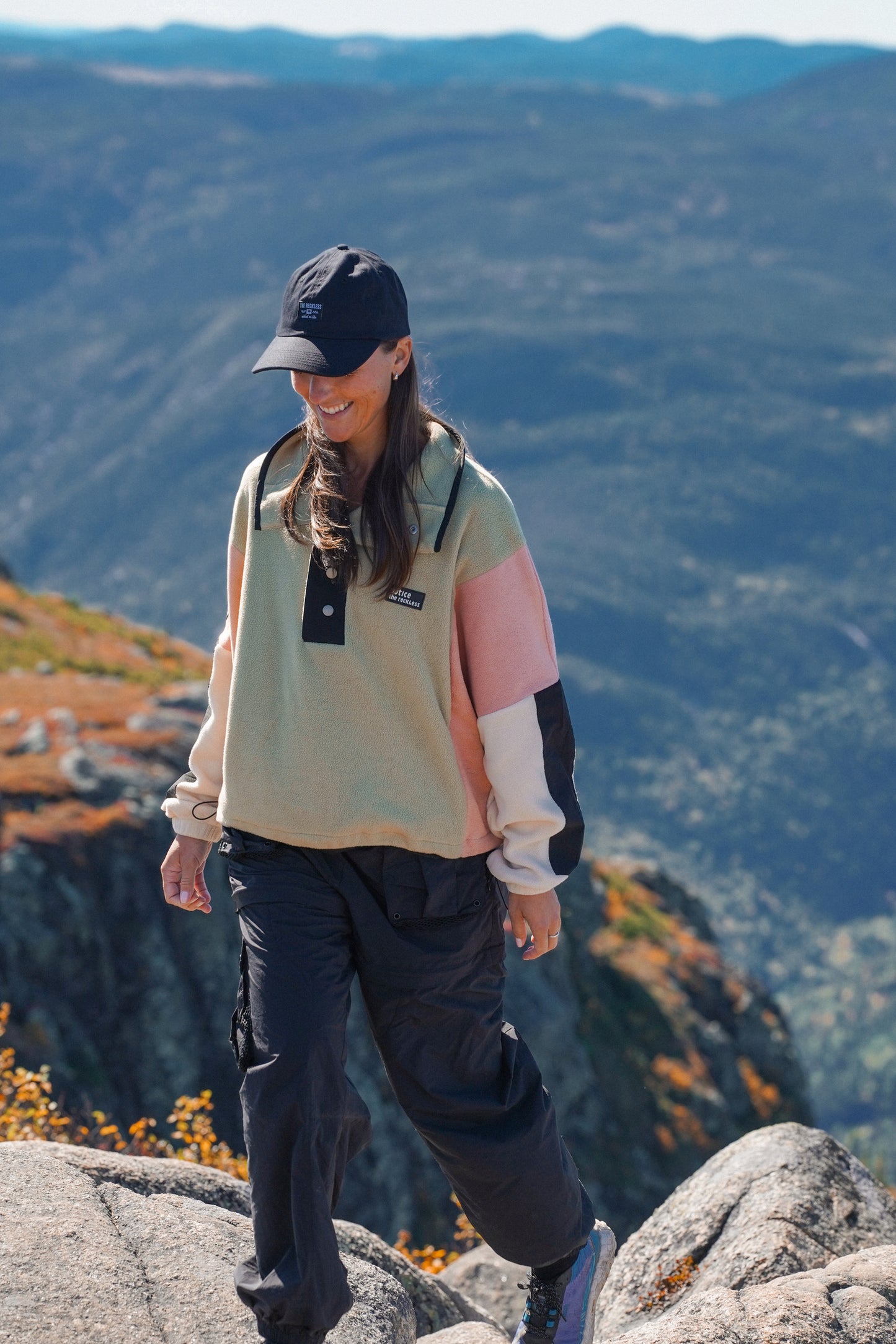 Women's cropped fleece hiking pullover with drop shoulders and adjustable waist drawcord