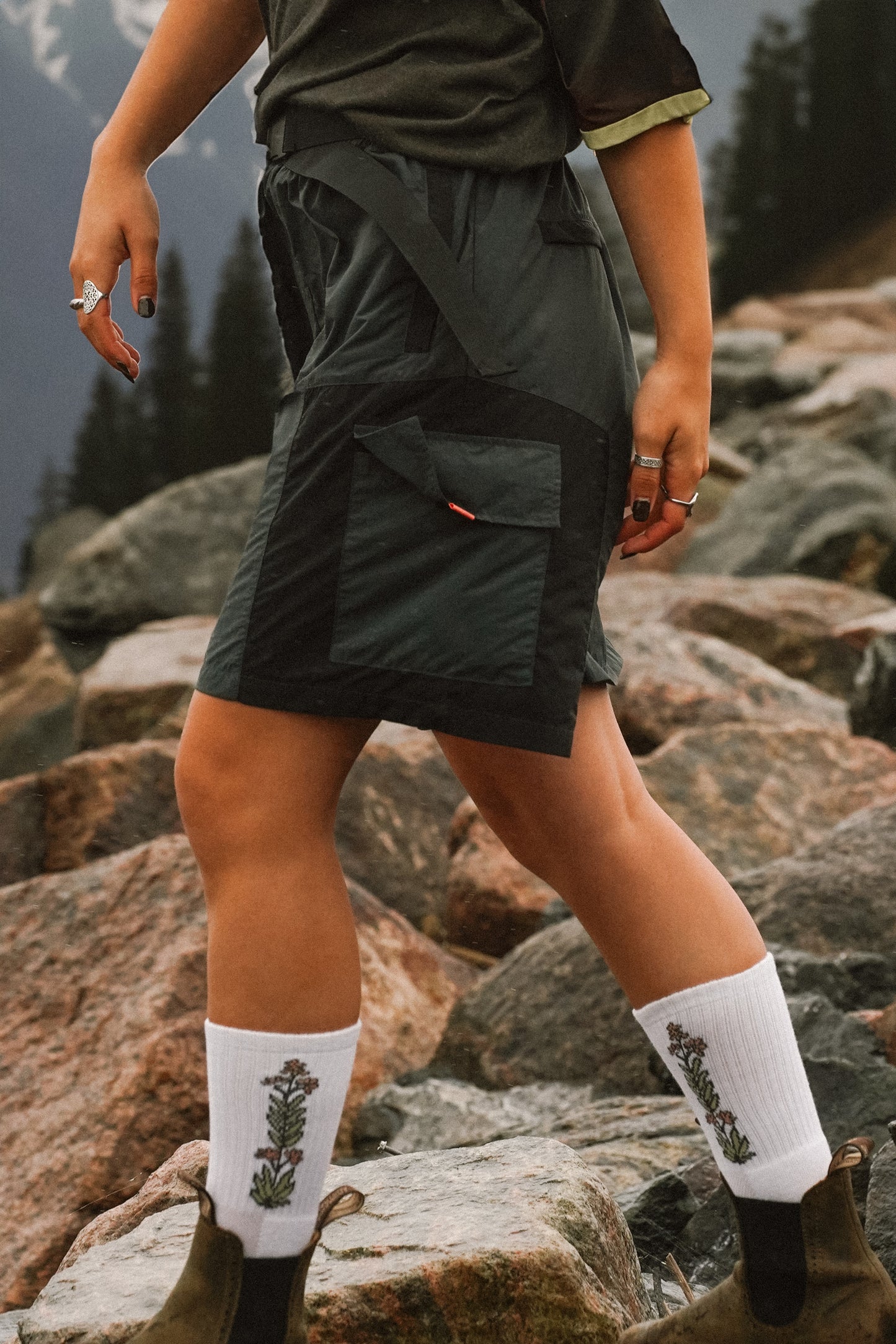 Women's grey hiking shorts with cargo pockets and elastic waistband for outdoor activities