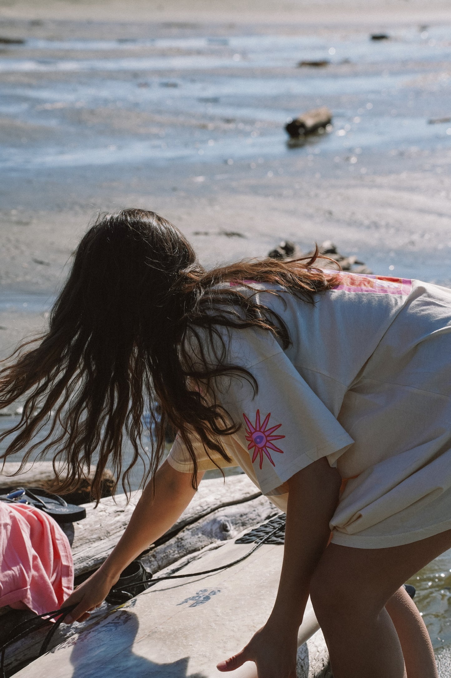 Oversized cotton t-shirt in ivory with Stay Salty graphic worn for summer surf and beach lifestyle