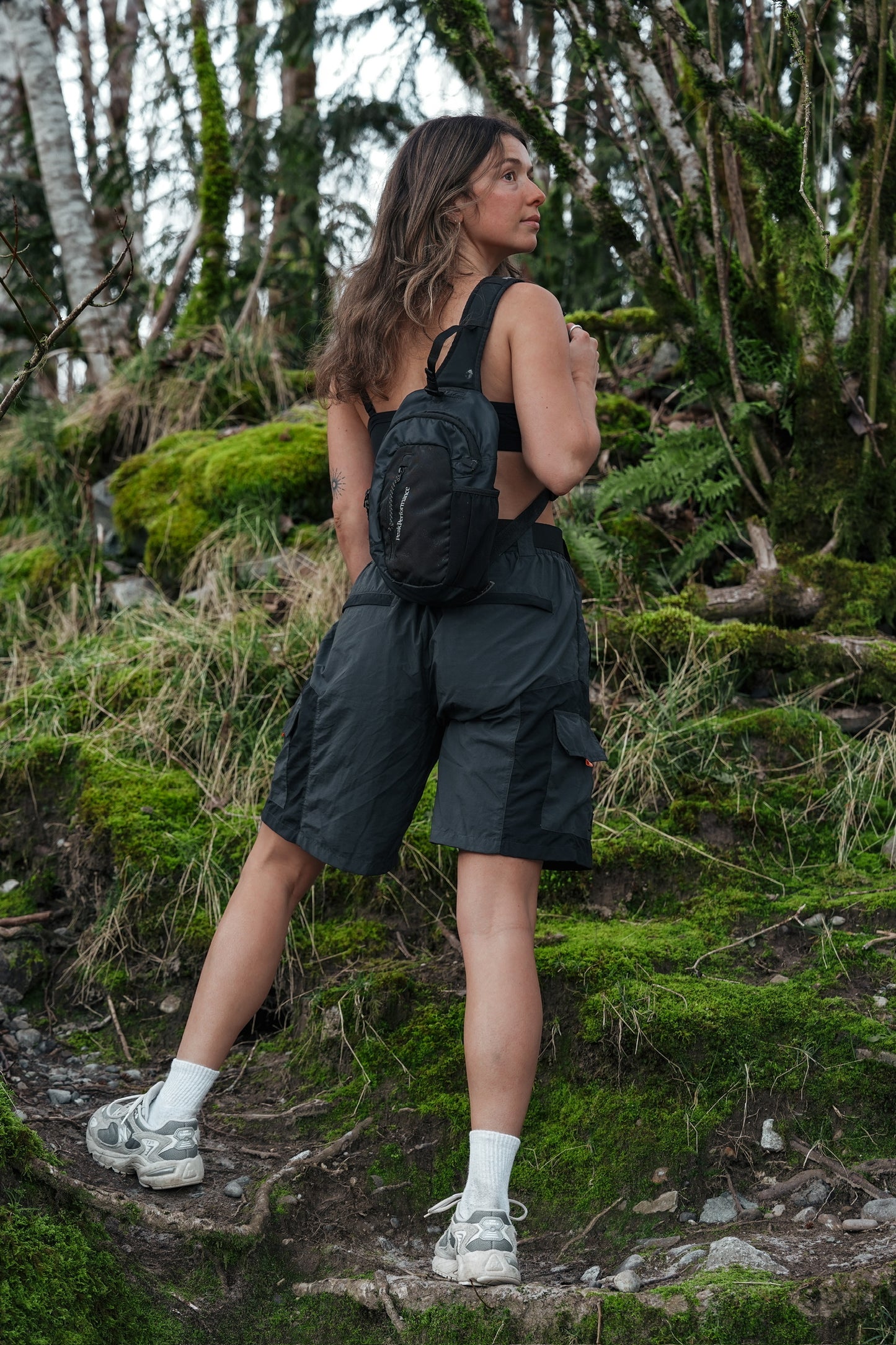 Women's grey and black hiking shorts with side cargo pockets and adjustable waist belt
