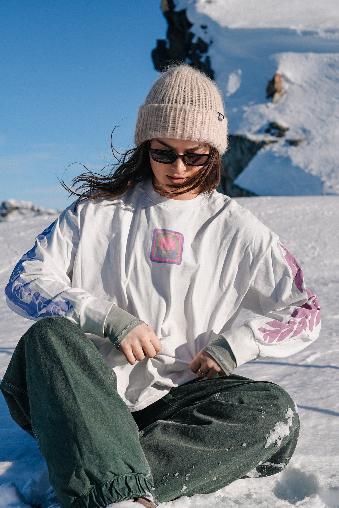Oversized white cotton long sleeve t-shirt featuring Gecko Surf Co back print and full sleeve graphics, ideal for casual layering